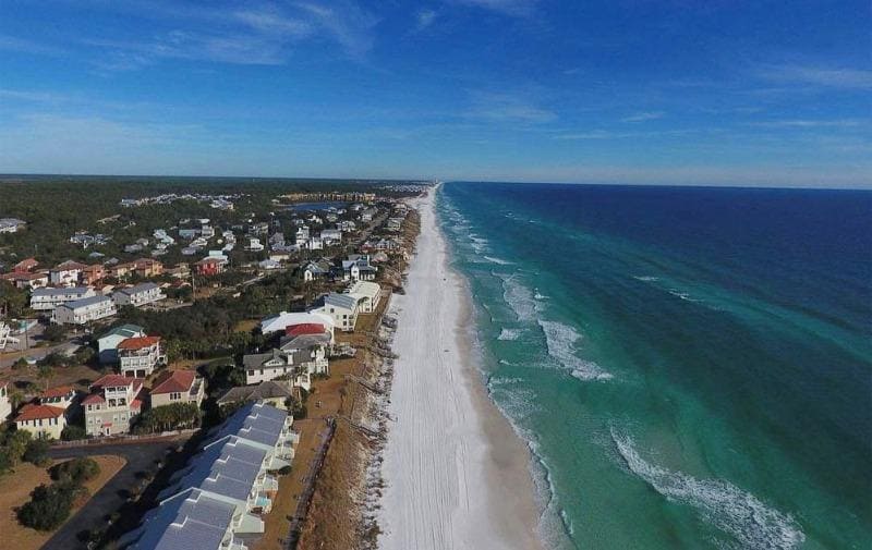 Seacrest Beach is a beautiful coastal community located along scenic Highway 30A in the northwest Florida Gulf Coast. It is known for its stunning white sandy beaches and crystal-clear turquoise waters, which contribute to an idyllic beach experience.

Seacrest Beach offers a charming and relaxed atmosphere, perfect for those seeking a quiet and peaceful beach vacation. The area is characterized by its vibrant community, with carefully planned residential neighborhoods, boutique shops, and delicious dining options.

One of the highlights of Seacrest Beach is the breathtaking shoreline. The soft, powdery sand creates a welcoming setting for sunbathing, beach walks, or building sandcastles. The calm waters are ideal for swimming, paddleboarding, and kayaking.

The community itself boasts beautiful architecture, featuring a mix of beach cottages, sprawling beachfront homes, and luxurious condos. With its well-maintained appearance and landscaped surroundings, Seacrest Beach gives off a charming and relaxing atmosphere.

One of the unique features of Seacrest Beach is the proximity to other popular destinations along Highway 30A. Within walking or biking distance, you can explore neighboring communities such as Alys Beach, Rosemary Beach, and Watersound Beach. Each of these areas offers its own distinctive charm and adds to the appeal of the region.

Seacrest Beach also offers various amenities for visitors. You can enjoy relaxing by one of the community's multiple resort-style pools or take advantage of the dedicated beach access points. Additionally, there are nearby shops where you can rent bicycles, making it a convenient and enjoyable way to explore the area.

Overall, Seacrest Beach provides a serene and picturesque beach experience. Whether you're looking for a peaceful family vacation or a romantic getaway, this coastal gem on 30A is sure to offer a memorable and enjoyable stay.