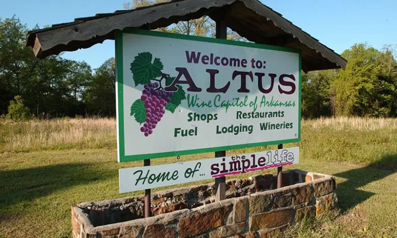 Nestled in the picturesque Ouachita Mountains, Altus, Arkansas is a tranquil gem known for its burgeoning wine country. This charming town echoes a rustic elegance, surrounded by rolling hills and lush vineyards that blanket the landscape. As you wander through Altus, the air is perfumed with the sweet scent of ripe grapes, inviting you to explore the local wineries that have earned recognition for their exceptional wines and friendly hospitality.

The heart of Altus’ wine country is its thriving vineyard community, where family-owned wineries offer a delightful array of tastings and tours. Visitors can savor a variety of locally produced wines, ranging from robust reds to crisp whites, all while soaking in stunning views of the verdant countryside. The welcoming atmosphere of the area reflects the pride of its winemakers, many of whom are more than happy to share their passion and knowledge.

Beyond its wine, Altus boasts a rich history and a close-knit community. The town's roots run deep, with historic buildings and charming storefronts lining its quaint streets. Local festivals celebrate the region’s wine heritage, drawing visitors from near and far to enjoy music, food, and of course, wine. Outdoor enthusiasts will also find plenty to love, with nearby hiking trails and scenic spots that provide perfect backdrops for picnics and wine tastings.

In Altus, you’ll experience more than just a visit to wine country; you’ll find a welcoming embrace of nature, community, and a way of life that celebrates the art of winemaking. Whether you’re a connoisseur or just looking to escape the hustle of everyday life, Altus is the perfect destination to unwind and savor the joys of the vineyard experience.