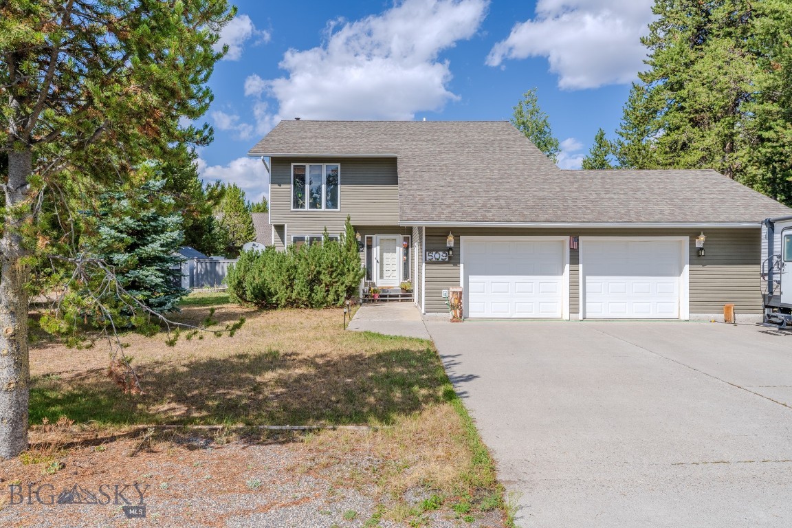 Welcome to 509 Gallatin Avenue, a spacious and well-maintained 4 bedroom, 2.5 bath home in the heart of West Yellowstone. This 2,000 square foot residence blends comfort, durability, and functionality with the unmatched access to outdoor adventure that makes this community so desirable. Set on a quiet street in the Madison Addition subdivision it offers close proximity to everything this beautiful area has to offer.

The home features a practical two-story design with inviting living spaces, including a cozy family room complete with fireplace, ideal for relaxing after a day of exploring. With a total of four bedrooms, there’s plenty of space for family, guests, or even a home office. An attached two-car garage provides parking and room for all your recreational gear. The home has been thoughtfully updated with all-weather siding and Trex decking, offering low-maintenance convenience and lasting curb appeal.

Beyond the home itself, the location is hard to beat. Nestled in a family-friendly neighborhood, this property places you just minutes from the West Entrance to Yellowstone National Park. Imagine the ease of access to some of the world’s most iconic landscapes, from geothermal wonders to abundant wildlife. The Greater Yellowstone Area is a true four-season playground: in summer, enjoy hiking, biking, and fishing; in fall, watch wildlife migrations unfold; in winter, take advantage of the area’s renowned snowmobiling and cross-country skiing trails; and in spring, explore uncrowded trails and fresh mountain air.

West Yellowstone itself is a welcoming, close-knit community. Residents enjoy local dining, unique shops, and the convenience of a nearby school—all with the charm of a small town surrounded by national forest and parkland. Whether you’re seeking a year-round residence or seasonal retreat this home provides the perfect balance of comfort, durability, and location.

509 Gallatin Avenue offers not only a home, but also an unparalleled lifestyle at the gateway to America’s first national park. Here, adventure begins right outside your door.
