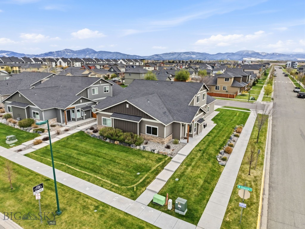 Located in the highly desirable Norton Ranch community, 5119 Dragonfly Street offers the perfect blend of comfort, functionality, and low-maintenance living. This 3-bedroom, 2.5-bath home features 1,693 square feet of thoughtfully designed space with a layout that fits a variety of lifestyles.

The main-level primary suite provides convenience and privacy, complete with a spacious walk-in closet and an en suite bathroom featuring dual vanities. The open-concept living area is filled with natural light and seamlessly connects the kitchen, dining, and living spaces, creating an inviting environment for everyday living and entertaining alike.

A cozy gas fireplace serves as the focal point of the living room, while sliding glass doors off the dining area lead to a private patio, offering the perfect spot to enjoy Montana's summer evenings. The smart floor plan maximizes both comfort and functionality, making the home feel spacious and easy to live in.

Additional features include a 2-car attached garage with ample storage space. Situated adjacent to a 4-acre neighborhood park and nearby walking trails, the property enjoys a sense of openness along with beautiful views of the Bridger Mountains.

Whether you're looking for your primary residence, a lock-and-leave lifestyle, or simply a well-located home in one of Bozeman's most sought-after neighborhoods, 5119 Dragonfly Street is worth a closer look.