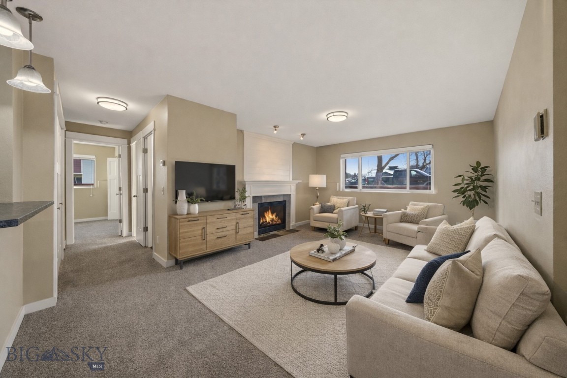 Affordable ownership in the heart of Bozeman. This well-maintained 2-bedroom, 1.5-bath garden-level condo offers 936 square feet of comfortable living with recent upgrades including new kitchen countertops, updated backsplash, and improvements to both bathrooms. A fireplace anchors the living area, creating a warm and inviting space year-round.

The functional layout includes two bedrooms, a full bath, and an additional half bath, along with a private one-car garage for storage and convenience.

Located just minutes from the Gallatin Valley Mall, Bozeman Pond, grocery stores, and everyday amenities, this central location provides easy access to trails, parks, and downtown Bozeman.

Offered at $310,000, this is a rare opportunity to secure a well-cared-for home at a price point that is increasingly difficult to find within Bozeman.