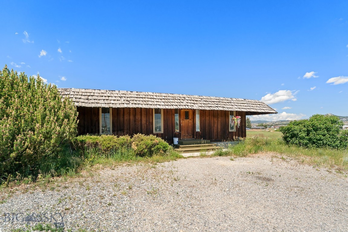 Discover a unique property in Butte, MT- This property offers a cozy  two bedroom one bath home sitting on a generous 1.82 acre parcel.   Light industrial (M1) zoning provides flexibility beyond typical residential parcels; ideal for buyers seeking business or mixed-use potential.