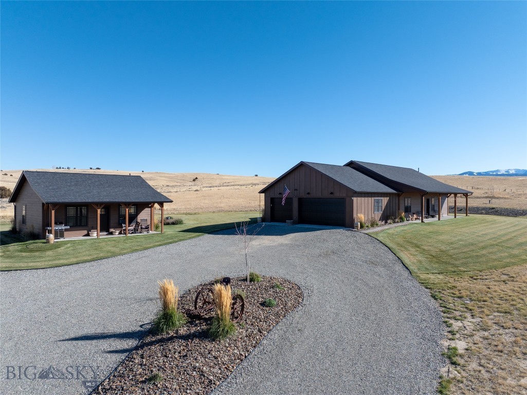 Built in 2022, this 1,600± SF home offers efficient design and high-quality finishes throughout. The large kitchen features GE black steel appliances, a double oven, gas cooktop, Corian countertops, two-tone cabinetry, and a farmhouse sink. In-floor radiant heat runs beneath tile floors styled after aged farmhouse wood.
Each bedroom is ensuite, with the primary suite including a double vanity, soaking tub, walk-in shower, and generous closet. A half bath in the hall leads to an oversized laundry/mudroom with a large stainless steel sink with a garbage disposal. The open living and dining area is ideal for entertaining, with a sunny south-facing entrance and expansive mountain views.
High-quality craftsmanship extends throughout with Anderson windows, Hardy plank siding, and a thoughtfully designed outdoor living environment featuring 360-degree views. The landscaped yard includes irrigation,  and established flower beds. The attached, finished 900± SF garage is plumbed and wired for a propane heater.
Guests will appreciate the detached 672± SF one-bedroom, one-bath ADU featuring a full kitchen, spacious living room, charming front porch, dedicated laundry room, and Rinnai propane heat.
Set on 25.678± acres at the end of the road, this property provides privacy, views, and minimal covenants with no HOA. Located about 10 miles southeast of Sheridan in the Ruby River Valley near Laurin, the property borders the Vigilante Irrigation Canal and lies approximately two miles from public fishing access in Alder. Thousands of acres of public lands begin roughly seven miles east up Mill Gulch Road.
A rare find combining efficiency, quality, and rural tranquility—just about a mile from pavement. Furnishings negotiable. Excellent as a year-round residence or summer retreat.