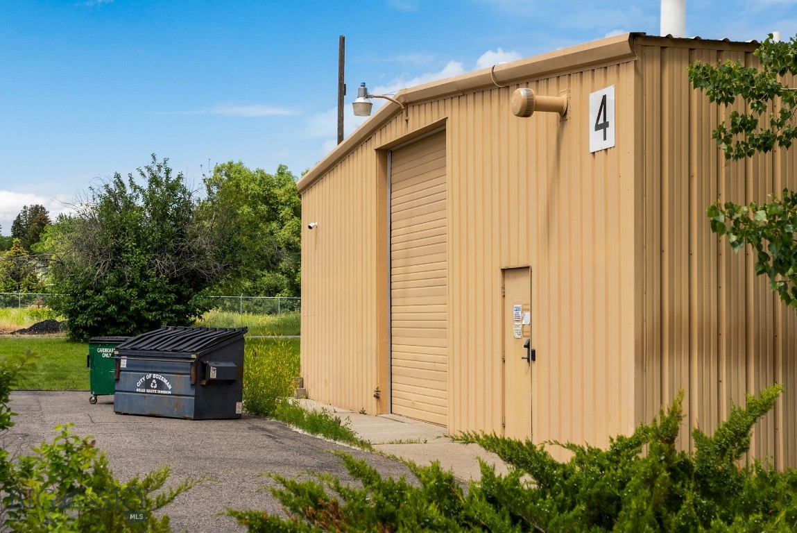 Hard to find large warehouse space close to Downtown Bozeman. Building has large open space on the north side, and approximately 15 smaller rooms. These rooms can be used as offices, research rooms, storage, mechanical, or many other options. Two large overhead doors, several access doors around the perimeter of the building. There is a kitchenette and several private restrooms. Key pad access at main door.