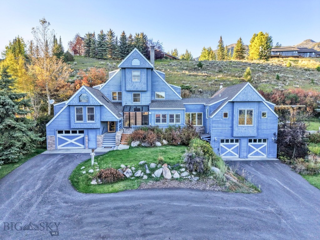 In the heart of Big Sky’s Meadow Village, this 2,866-sq-ft furnished Nantucket-style residence blends character, craftsmanship, and convenience. Featuring 4 bedrooms and 4 bathrooms—including a private guest suite—this fully custom home was designed for both comfort and versatility. You won’t find another home like this in Big Sky.
Inside, rich details abound: thoughtfully crafted built-ins, beautiful stained-glass accents, an efficient wood stove, a gas fireplace, and radiant-floor heat in the addition ensure cozy comfort year-round. A bright sunroom off the entryway welcomes natural light and overlooks the landscaped grounds, while an expansive family-room addition with wet bar creates an ideal space for entertaining or relaxing after a day in the mountains. From here, step out to a lovely outdoor patio—perfect for gatherings or quiet evenings alike.
Outdoors, the lifestyle continues. Set on over a half-acre of beautifully landscaped grounds, the property offers a large driveway, three garage spaces, and two golf carts for direct access to the Big Sky Golf Course just across the street. Down the road, the Big Sky Community Park offers tennis and pickleball courts, playgrounds, a skate park, and Little Coyote Pond for fishing, swimming, and year-round recreation. In winter, cross-country ski trails start right outside your door, with world-class downhill skiing at Big Sky Resort only minutes away.
This is more than a home—it’s an unmatched four-season lifestyle at the center of everything that makes Big Sky special.