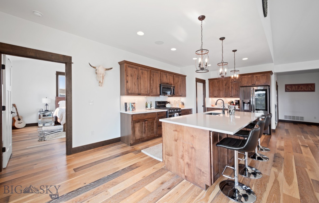 Turn heads from the moment you arrive at this beautifully designed home with standout curb appeal, set on a full acre of thoughtfully landscaped land. Lush lawn, mature plantings, and underground sprinklers keep the grounds looking pristine with ease. Offering 2,800 sq ft of well-planned space, this home features a bright, open-concept layout that seamlessly connects the living, dining, and kitchen areas—perfect for entertaining or everyday comfort.

The spacious main level includes a beautiful kitchen with lots of cabinets, a huge island for eating and dining, large living area with vaulted ceilings and large windows to let in natural light.  In addition there is a beautiful master suite with luxurious bathroom including a big walk-in tiled shower, 2 additional bedrooms and another full bathroom., providing plenty of room for family and guests. Upstairs, a versatile bonus room area and its own bedroom and full bath—ideal for a private guest suite, home office, or multi-generational living.  Throughout the home, you’ll find tons of storage space, ensuring everything has its place.

Additional highlights include an oversized 3-car garage with room for vehicles, tools, and toys, plus extra storage options. With its combination of functionality, space, and beautifully maintained grounds, this property offers the perfect blend of comfort and convenience inside and out.  A property anyone would be proud to call home!