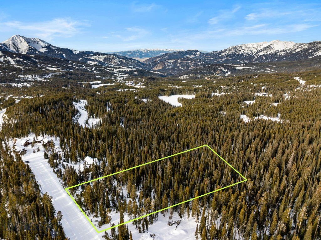 Perched in the prestigious Cascade subdivision, Lot 124A offers a rare opportunity to build your dream mountain retreat in beautiful Big Sky. Situated on White Butte Road, this premium homesite perfectly balances alpine seclusion with unparalleled convenience. This lot is a recreationist dream, boasting effortless walkability to the Cascade chairlift. Forget the hassle of parking or shuttles; from your front door, you are just a short stroll away from world-class terrain. Whether you’re chasing first tracks or enjoying a midday break, the proximity to the lift ensures you spend more time on the slopes and less time in transit. This lot has breathtaking vistas with views of Lone Peak, The Spanish Peaks and surrounding forest. Just minutes from the amenities of Big Sky’s Mountain Village and the One&Only Moonlight Basin.
