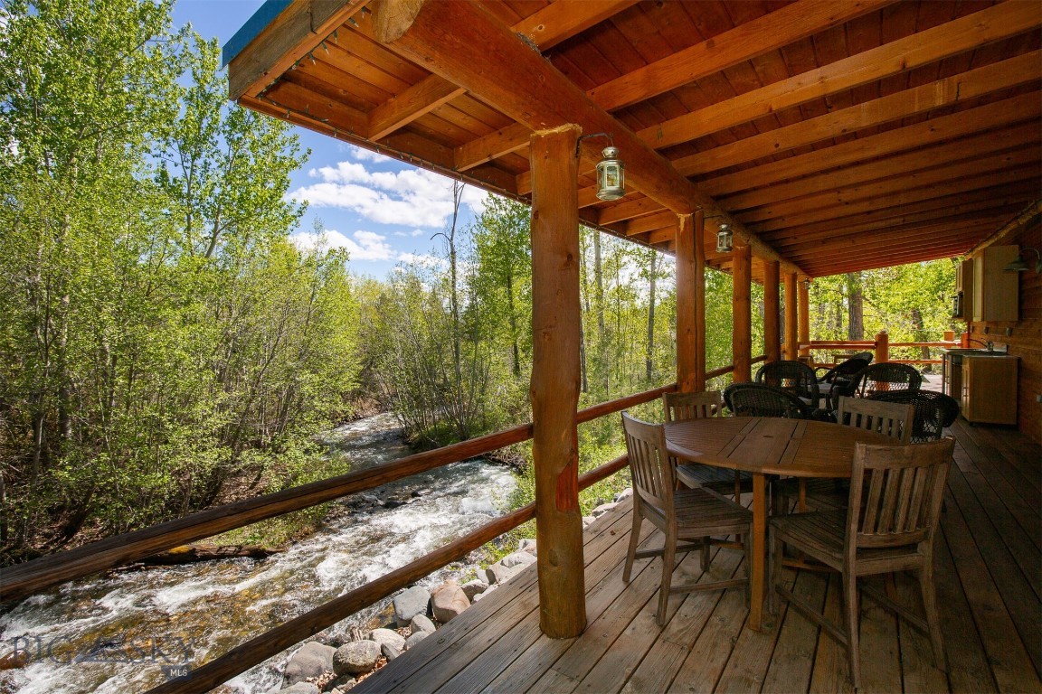 Discover your serene retreat in the heart of Montana’s Ruby Valley! This charming 924 sq ft cabin, nestled along the swift moving Wisconsin Creek near Sheridan, MT, offers a perfect blend of rustic charm and modern comfort. Situated on an expansive 18.37 acre property, this idyllic getaway boasts approximately 1/4 mile of creek frontage and surrounding mountain and valley views. From the covered deck, enjoy savoring peaceful mornings and warm summer evenings. Every window is intricately placed to maximize creek and mountain views. The property is a haven for creativity and self-sufficiency, featuring two dedicated painting studios—his and hers—perfect for artists seeking inspiration in Montana’s stunning landscape. Cultivate your green thumb in the fenced garden area with raised beds, orchard, & complemented by a greenhouse for a longer growing season. Near the orchard is an RV parking site with 110v and 220v power, and water. On the south side of Wisconsin Creek along the county road is another building site perfect for another residence, shop, etc. Surrounded by the natural beauty of the Ruby Valley, this property offers privacy, space, and endless opportunities for outdoor adventure. With the property bordering BLM lands and multiple blue ribbon fishing rivers nearby - this location is a natural playground for any avid recreationalist. Wet your line right below the cabin in the creek filled with trout. Whether you’re seeking a cozy full-time residence or a seasonal escape, this unique property delivers an unparalleled lifestyle in one of Montana’s most picturesque regions.