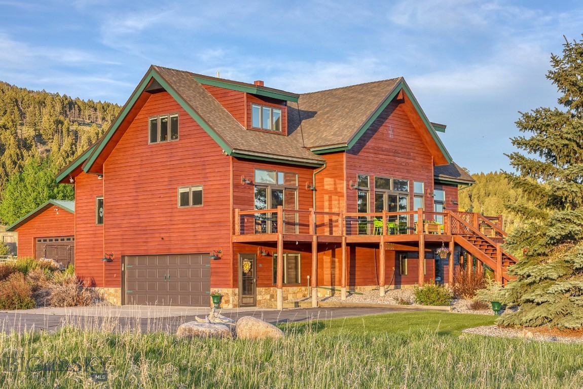 Set just across the street from Hebgen Lake with sweeping lake views and room for everyone, this spacious 3,845-square-foot mountain home offers the ideal blend of comfort, functionality, and year-round recreation. Built in 1999 and thoughtfully designed across three levels, the home features four bedrooms, four and a half bathrooms, and inviting gathering spaces throughout.
At the heart of the home is a warm and welcoming great room with a wood-burning fireplace, vaulted ceilings, and large windows that capture the beauty of the lake and surrounding landscape. The chef’s kitchen is designed for entertaining, flowing seamlessly into a cozy dining area and out to an expansive deck built for summer barbecues, outdoor dining, and evenings spent taking in the views.
The large yard provides plenty of space for kids, pets, and outdoor games, while the indoor hot tub offers the perfect place to unwind after a day on the water or trails. With both an attached two-car garage and a detached two-car garage, there is ample room for vehicles, boats, snowmobiles, and all your Montana adventure gear.
Located just a two-minute drive from Kirkwood Marina, this property delivers easy access to boating, fishing, and endless outdoor recreation while offering the privacy and comfort of a true mountain retreat.