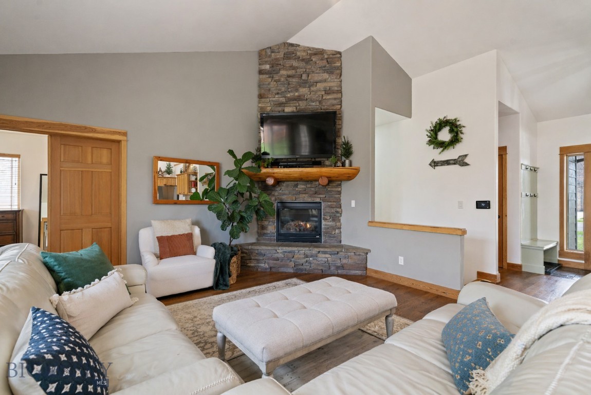 This expansive, 5 bedroom home with a 3 car garage, has so many extra features! Designed for both everyday living and entertaining, the open-concept main floor features a huge rock fireplace, real hardwood floors, granite countertops, a formal dining room, and a sunny breakfast nook. The spacious primary suite includes an oversized walk-in closet, while the remodeled primary bathroom feels like a spa! Two additional bedrooms, the kitchen, laundry area, and pantry are also on the main level.

In the basement, there is A MOVIE THEATER, two bedrooms, a storage room, a salon space that can easily be converted back into a second laundry room, built-in bookshelves, and a large bonus room perfect for a game room, fitness space, guest suite, or home office.

Situated on a half-acre corner lot, the outdoor space is just as impressive with a fenced backyard, wrap-around front porch, and an expansive concrete backyard patio that gets the evening shade, ideal for gatherings or relaxing evenings in the hot tub (included).  

Additional highlights include abundant storage throughout, numerous upgrades and improvements, plus theater couches and electronic equipment that will convey with the home. This property truly has room for everyone and everything!