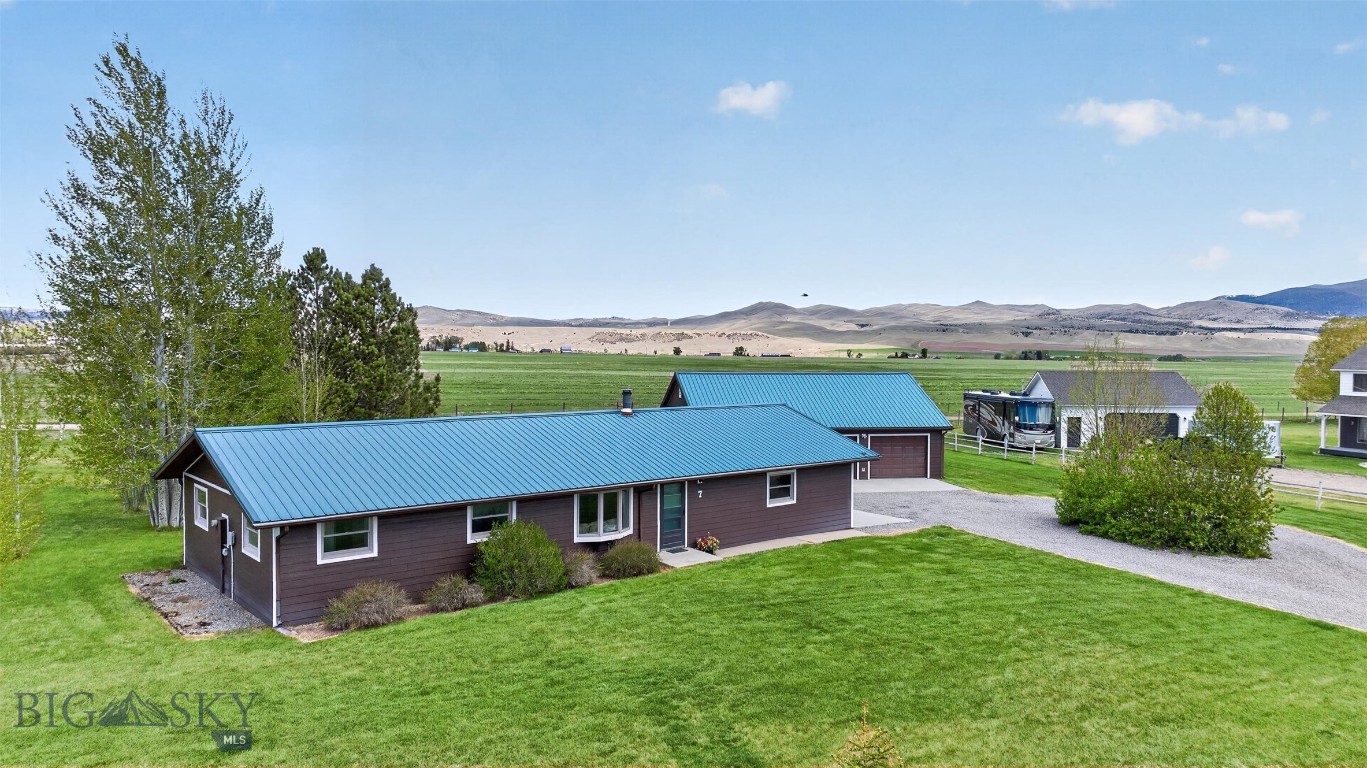 Welcome to 7 Kokanee Drive in McAllister, Montana, a well-maintained country property offering the space and functionality to match the lifestyle of the Madison Valley.
Set on 1.073 acres with mature trees and irrigation water rights from the ditch bordering the north property line, this 4 bedroom, 2 bathroom home is a comfortable and capable property with room to spread out both indoors and out.
The 1,232 square foot home features an updated kitchen completed in 2013, new exterior siding installed in 2023, and a cozy wood stove. Four bedrooms offer flexibility for guests, hobbies, a home office, or larger households.
Beyond the attached one-car garage, the property includes a detached two-car garage and shop that is both insulated and heated, ideal for year-round projects, woodworking, or serious storage needs. A greenhouse rounds out the outdoor amenities, making this a property that works as hard as you do.
The large yard is shaded by mature trees, and irrigation water rights provide excellent potential for gardening, landscaping, or keeping things green through the dry summer months.
Situated between Ennis and the recreational heart of Southwest Montana, 7 Kokanee Drive offers easy access to world-class fishing, hunting, hiking, and year-round outdoor adventure, all from a quiet country setting.