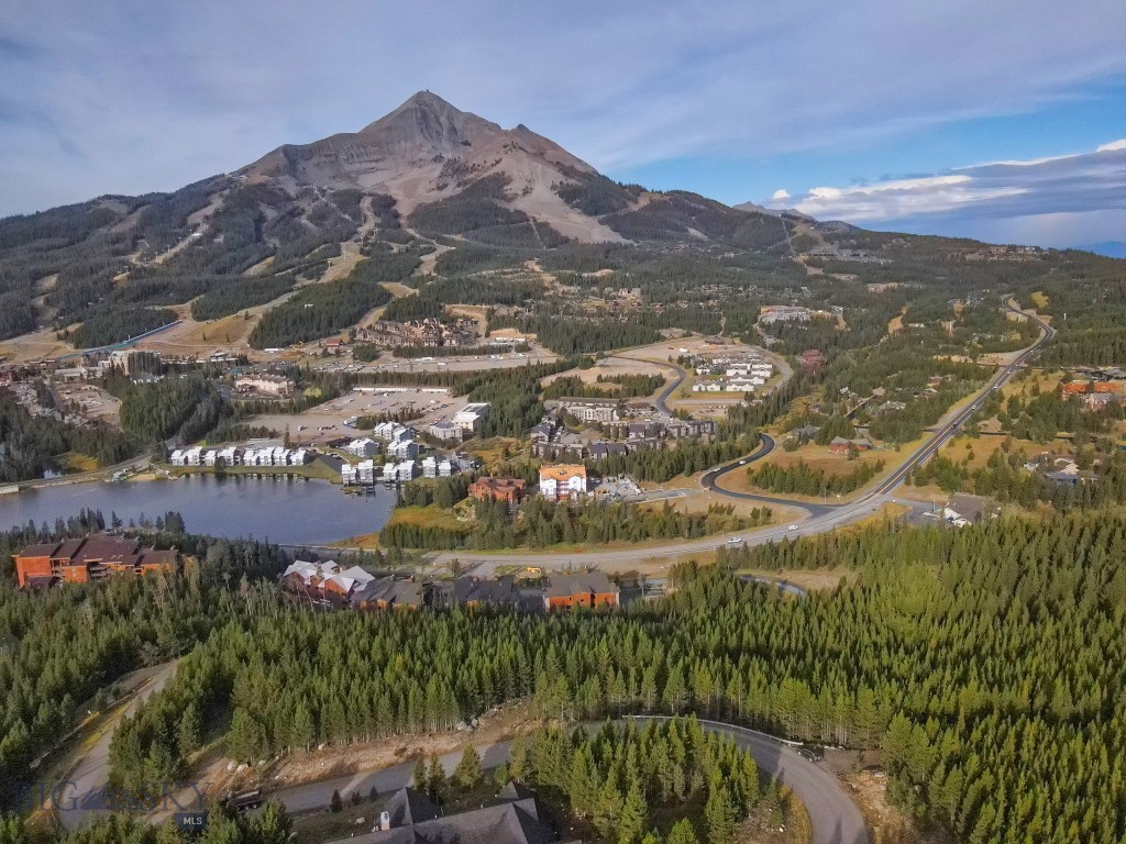 Build your dream home on this premier 2.52-acre lot in the exclusive gated community of Summit View. Perched high above Big Sky, this property offers sweeping, unobstructed views of the iconic Lone Peak and the Big Sky Resort slopes. With bold mountain vistas in every direction, the setting captures the essence of Montana’s alpine beauty.

South-facing exposure ensures year-round sunshine, natural warmth, and dramatic alpenglow evenings. The generous acreage provides both privacy and space, with ample room for designing a legacy mountain retreat. Nestled within a secure, gated neighborhood, the property offers peace and exclusivity while remaining conveniently close to the resort village, skiing, hiking, and all the outdoor recreation Big Sky is known for.

This Summit View lot combines privacy, panoramic views, and prime location—an exceptional opportunity to create a home in one of Big Sky’s most desirable settings.
