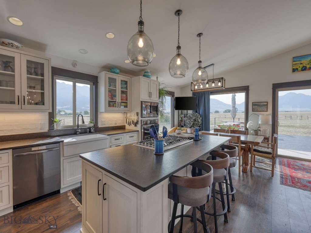 20 Acres in Paradise Valley – Fully Remodeled Home with Shop, ADU & State Land Access Experience refined Montana living on 20 acres in Paradise Valley, backing up to 333 acres of state land and just minutes from the Yellowstone River. This 3,172 sq. ft. residence underwent a complete remodel in 2021/2022, blending custom craftsmanship with modern luxury. Inside, you’ll find Alder trim, custom doors, and all-new flooring throughout. The chef’s kitchen features top-end finishes, while a custom teak wet bar and multiple entertainment areas elevate the home for hosting, complete with a 120” projection screen, 75” 8K TV, 55” 4K HD TV, 50” TV behind the bar, and wine fridge. The great room centers around a Tulikivi Soap Stone fireplace imported from Finland, complemented by new windows with redwood trim. The master suite offers a spacious walk-in closet with direct access to the laundry and powder room. The spa-like master bath showcases marble tile, a heated floor, rain shower, free-standing bathtub, heated towel racks, and sweeping views of Emigrant Peak and the Absarokee Mountains. Every bathroom is uniquely designed and includes high-end smart toilets with built-in bidets. Additional highlights include: 3 car insulated and heated garage with new openers (2022) Air conditioning (2022) Above-ground pool and new Hot Springs hot tub (2022) 1,728 sq. ft. shop with stove Private ADU with hot tub for guests or income potential Huge south facing deck with a Pergola This property offers the rare combination of privacy, recreation, and luxury, all framed by the dramatic beauty of Paradise Valley.