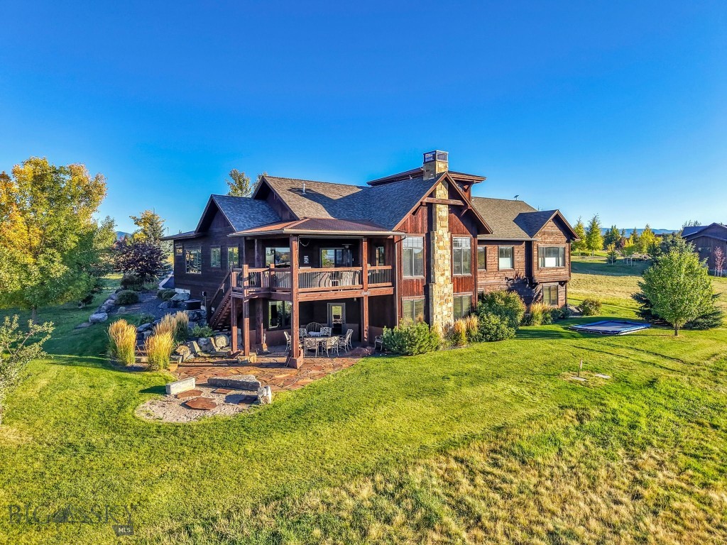 Located on Hole #2 of Black Bull Golf Community, this 6-bedroom, 4.5-bath home combines rustic wood finishes with luxury living on a 0.39-acre lot. Built in 2013, the home features a gourmet kitchen with a built-in coffee and espresso station, a large walk-in pantry, and open living areas that lead to the covered back patio with spectacular sunset views. The main level includes a private guest suite with a separate entrance, while the second floor offers an office with 360-degree panoramic views. The primary suite features heated bathroom floors, a steam shower, a jetted tub, and an oversized walk-in closet. The walk-out basement has heated floors and includes four bedrooms, two bathrooms, and a private theater room. Additional features include a Sonos sound system throughout, an oversized 3-car garage, and a large storage area above it. All of this, within one of Bozeman’s premier golf communities!