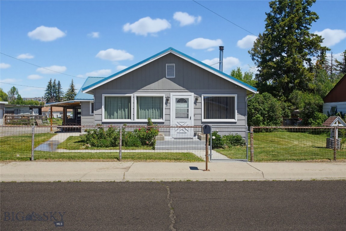 817 Evans Ave, Butte, MT:  Farmhouse Charm on Nearly an Acre

Welcome to 817 Evans Ave in Butte, Montana, where farmhouse charm meets the convenience of in-town living. Situated on a spacious 0.95-acre lot, this adorable 3-bedroom, 1-bath home offers the rare opportunity to enjoy the feel of country living while remaining just minutes from shopping, schools, restaurants, and everyday amenities.

Inside, you'll love the warmth and character created by beautiful blue pine walls and a cozy wood-burning stove, giving the home a true farmhouse feel. The updated kitchen features brand-new butcher block countertops, blending rustic style with modern functionality, while the main-floor laundry adds everyday convenience.

Step outside and discover everything this property has to offer. The 3-car garage provides ample space for vehicles, a workshop, hobbies, or storage, and the additional outbuildings offer even more room for tools, equipment, recreational toys, or seasonal items. The 0.95-acre lot provides space to garden, entertain, park an RV, or simply enjoy the peaceful setting.

A standout feature is the outdoor hot and cold water spigot, making it easy to wash pets, clean vehicles, rinse off after yard work, or tackle outdoor projects. The home also features an on-demand tankless water heater, providing energy-efficient hot water whenever you need it.

If you've been searching for a farmhouse in Butte, MT, a home with acreage, multiple garage spaces, outbuildings, and the charm of country living while still enjoying the convenience of an in-town location, 817 Evans Ave is one you won't want to miss.