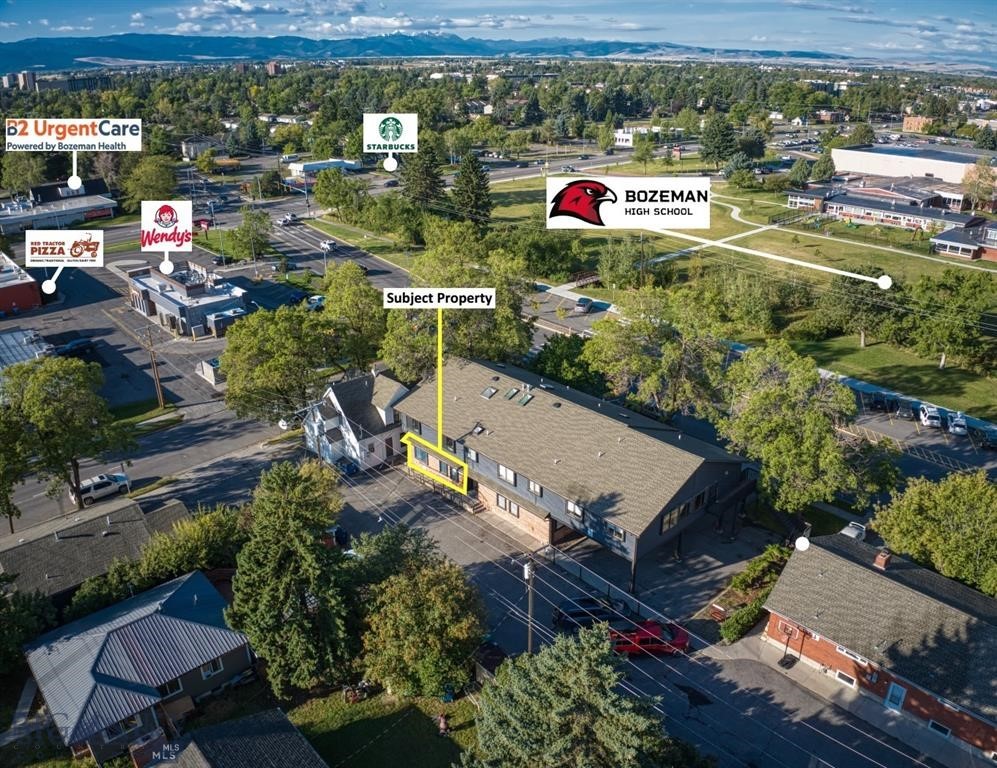 Exceptional opportunity to own a centrally located ±1,510 SF ground floor commercial condo just off Main Street on N 11th Avenue, directly across from Bozeman High School. This well-designed space features an efficient layout with multiple private rooms, a reception area, private office, breakroom with kitchenette, and a single-occupant restroom. Dual access points enhance functionality and provide seamless flow for both staff and clients. Positioned above a basement level, the unit offers added flexibility for future mechanical, electrical, and plumbing improvements. Located within a professional condominium setting with a strong mix of established users, the property benefits from excellent accessibility and close proximity to downtown Bozeman, surrounding neighborhoods, and everyday amenities, making it well-suited for a wide range of professional uses.