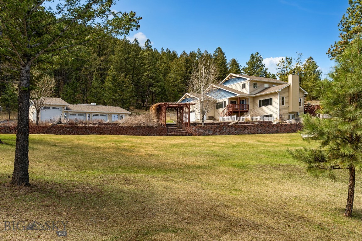 Tucked neatly in at the end of a curved private paved driveway, you will find the haven you have been seeking. Situated on 10+acres and bordered by BLM on one side, you will find a beautiful family home at the edge of the trees, overlooking a park like setting. This rare gem is located only 5min from Helena, in Mt City.
 This amazing property is home to a 4br, 3.5 bath multi level house that offers wonderful space and separation for everyone in the family, and large gathering and entertaining spaces as well. Taking advantage of this location, outside you will find a wrap around deck that leads to a fenced yard with underground sprinklers, and a hot-tub patio. Regularly visited by Elk, the fall can be quite the spectacle in your own yard.
 Adjacent to the house is where you will find a detached shop with all the amenities, including in floor heat, an office space, a full bath, tool and mechanical room, and three full bays to fill up with toys or projects.
 The most amazing part? NO COVENANTS! It should also be mentioned that the well produces so much it is artesian! Do not let this opportunity pass by, the odds of finding all of this again are nearly impossible.