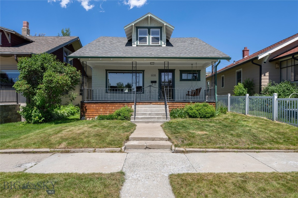 Full of character and original charm, this Craftsman home features beautiful wood trim, many original light fixtures, and timeless details throughout. The inviting front porch with a porch swing is the perfect place to enjoy your morning coffee, while established perennial landscaping adds great curb appeal to the front and sides of the home. Inside, the main level offers a welcoming entryway with beautiful French doors leading into the living and dining rooms. Original hardwood flooring runs throughout the main level, with tile in the kitchen and bathroom. Two bedrooms and a full bathroom are located on the main floor. The entire upper level is dedicated to a spacious primary suite featuring two walk-in closets, a full bathroom, and additional flex space that could be used as a home office, reading nook, sitting area, hobby space, or whatever best fits your needs. Outside, you'll find a fully fenced backyard, a storage shed, and a new concrete patio poured within the last year, providing a great space to relax or entertain. Conveniently located on Butte's lower west side near Montana Tech, St. James Hospital, West Elementary School, and all that Uptown Butte has to offer, 1135 Steele Street combines historic charm, functional living space, and a location that's hard to beat. Schedule a showing today!
