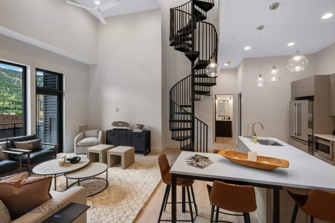 Elevate your everyday in Residence 3A, a thoughtfully designed 2-bedroom, 2.5-bath penthouse perched atop The Franklin—Big Sky’s newest boutique residential building in the heart of Town Center. Perfectly tailored for both quiet escapes and effortless entertaining, this home pairs refined mountain style with unbeatable walkability.

Inside, the airy floor plan is enhanced by 11-foot ceilings and curated finishes that strike the perfect balance between comfort and sophistication. Large windows draw in natural light and frame expansive vistas, while the open living space flows seamlessly onto a private rooftop terrace—complete with a hot tub—offering sweeping views of Yellow Mountain, Lone Peak, and the adjacent golf course.

Crafted by Bechtle Architects and built by Langlas Construction, The Franklin is a thoughtfully executed building offering the ease of lock-and-leave living with premium features: sound-insulated walls, heated underground parking, and private storage for your mountain gear.

From morning walks to your favorite coffee shop to evenings catching live music or dining nearby, Residence 3A puts you steps from it all. And when adventure calls, Big Sky Resort is just 10 minutes away, with river access and trailheads even closer. Move-in ready and designed for year-round enjoyment, this penthouse is more than a residence—it’s your personal launch point to the Big Sky lifestyle.
