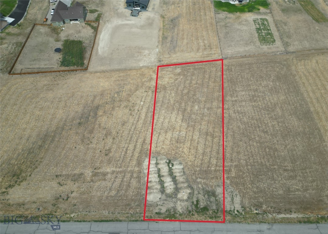 Discover 36 Western Larch Place, a beautiful 1.05-acre buildable lot for sale in Three Forks, Montana. Located just west of town in the desirable Village at Elk Ridge, this spacious parcel offers the perfect opportunity to build your custom home while enjoying the peace, privacy, and panoramic views that define Montana living.
This premium Montana acreage features views including wide-open mountain vistas, rolling hills, and stunning sunrises and sunsets. An ideal setting for anyone seeking a quiet retreat with convenient access to modern amenities. The property is just minutes from the friendly downtown Three Forks, where you’ll find local dining, shopping, and community events, and a short drive to abundant amenities of Bozeman, Helena, and Butte.
Outdoor recreation is plentiful, with nearby access to Missouri Headwaters State Park, boasting world-class fishing, hiking trails, boating, and wildlife viewing. Elk Ridge is also minutes away from prime hiking and mountain biking trails at Copper City. Within the Elk Ridge community, residents enjoy a 3+ acre park with baseball and soccer fields, a basketball court, and a covered picnic gazebo. Conveniences perfect for families and outdoor gatherings.
This Three Forks land for sale is ready for construction, offering paved roads, essential utilities, and a peaceful neighborhood setting. Whether you’re planning a full-time residence, vacation home, or investment property, this lot provides exceptional value and endless potential.
Don’t miss your chance to own Montana land with views, space, and convenience. Schedule a showing today and start planning your dream home at 36 Western Larch Place.