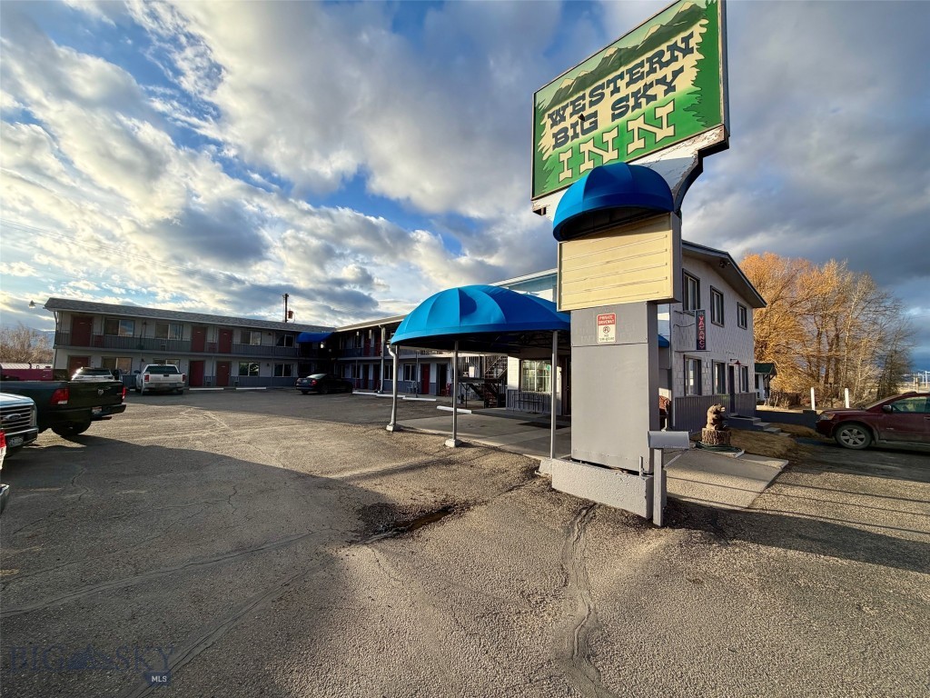 Located at the edge of downtown Deer Lodge with easy access to Interstate 90, the Western Big Sky Inn presents a well maintained, turn-key lodging asset with both operational stability and meaningful upside potential. Its strategic positioning between Missoula, Butte, and Helena allows it to consistently capture highway traffic while also serving the growing demand for longer-term accommodations in the area. The property features 20 guest rooms, including 13 double queen units, 3 king rooms, 4 single queens, and 2 kitchenette units, offering a flexible mix to accommodate both nightly and extended-stay guests. Since 2022, the property has undergone numerous updates, including exterior renovations enhancing curb appeal and modernizing 7 rooms. The property also boasts an on-site 2 bed, 1 bath apartment with direct office access, ideal for an owner-operator or on-site management structure. This feature makes the property attractive as a “mom-and-pop” investment or those desiring live in management operation. Additional amenities include an inviting lobby, a full kitchen for continental breakfast service, and a full basement providing ample storage, adding both operational efficiency and long-term utility. The Western Big Sky Inn offers clear pathways for revenue growth all while boasting a 4.3 of 5 stars on google reviews. Continued updates, refined management practices, and the potential conversion of additional rooms into kitchenettes or apartments align with increasing demand for workforce housing driven by major local employers including the regional medical center, Montana State Prison, and other seasonal employers. With its manageable size, recent improvements, and strong repositioning potential, this property represents an attractive entry point into Montana’s lodging market. Inquiries welcome for qualified buyers seeking a well-located lodging asset with both stability and upside. Ask about the nearby Travel Inn, a complimentary hotel investment opportunity.