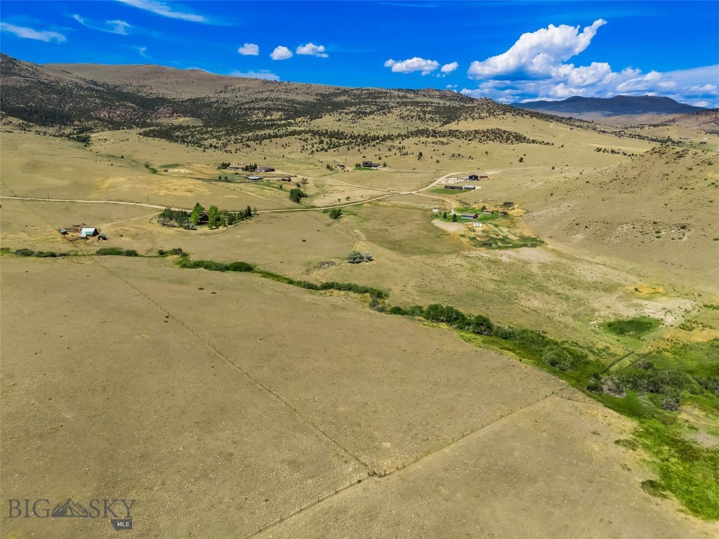 Discover your slice of Montana paradise with this stunning 10-acre parcel featuring Trail Creek meandering through the property, offering both beauty and tranquility. With sweeping views of the majestic Madison Range, this land is an ideal basecamp for endless recreational opportunities. Enjoy world-class fly fishing on the nearby Madison River, hiking and horseback riding in the surrounding public lands, or take off-road adventures on nearby trails. In winter, access to snowmobiling and cross-country skiing is just minutes away. Located conveniently between Bozeman and West Yellowstone, this property provides the perfect balance of remote privacy and accessibility to town amenities, airport access, and Yellowstone National Park. The property is currently in the process of being subdivided, so exact boundaries and access easement are to be finalized. A rare opportunity to own land with no covenants, abundant wildlife, and direct creek access—ideal for a future cabin or recreational retreat. Don't miss this chance to own a truly special piece of Montana.