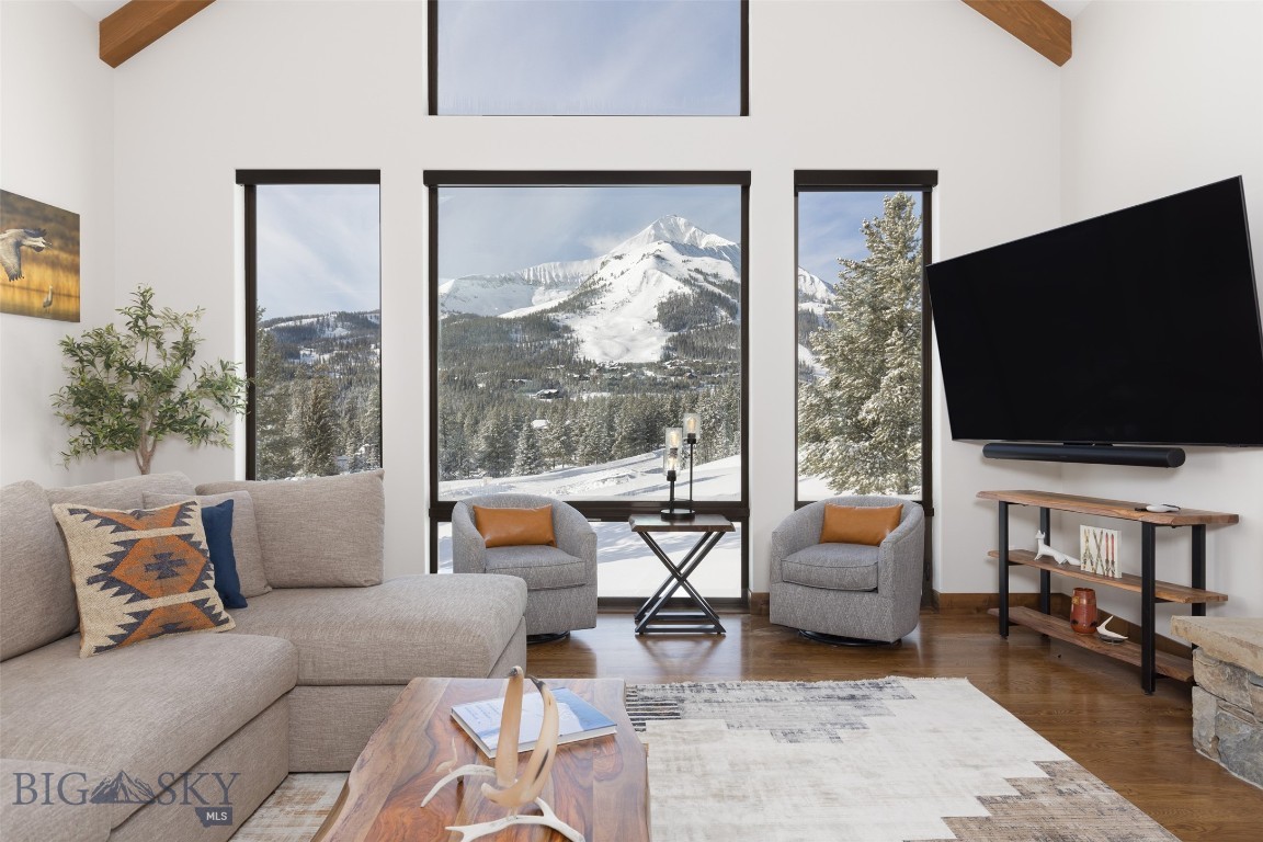 19 White Grass is a sun-filled, ski in/ski out mountain residence completed in January 2023, offering a rare blend of modern luxury, energy efficiency, and thoughtful design in a cul-de-sac location. This home features one of the very few Big Sky properties with an automated oxygenated bedroom, allowing rapid acclimation to high altitude. Positioned to capture sweeping views of Lone Peak, Andesite and the Gallatin Range, this five-bedroom, five-and-a-half-bath home spans 5,052 square feet and is designed for effortless year-round living in Big Sky. Expansive windows, covered decks, and multiple outdoor gathering spaces invite you to take in the scenery in every season.

Built for comfort and durability, the home features geothermal heating and cooling, radiant floor heat, humidification, central air conditioning, and a cold roof — setting this mountain property apart from other luxury homes. Fire-conscious construction includes a fiber cement exterior and a full fire-suppression system, offering both efficiency and peace of mind. Every detail has been carefully considered to create a home that performs as beautifully as it lives.

Interior spaces are thoughtfully appointed, beginning with a dedicated ski room for seamless mountain access. Exceptional storage throughout the home ensures space for all seasons — from mountain gear and recreational equipment to owner storage and everyday essentials — making organization effortless. The main living area showcases hardwood flooring, quartzite and marble finishes, Sonos audio, and multiple propane fireplaces — including a striking double-sided fireplace in the primary suite. The suite also offers direct access to a private hot tub, while invisible screens on exterior doors allow fresh mountain air to flow freely. A walk-in pantry and potential for a wine room elevate the entertaining experience, and abundant natural light enhances the home’s warmth and inviting atmosphere.

Flexible upper- and lower-level living spaces provide exceptional versatility. The lower level can serve as a private retreat and can be locked off for rental potential, featuring 3 bedrooms, 3 bathrooms, a living area with kitchen, a private hot tub and a fire pit. With ski access via the Cascade Lift, exceptional build quality, abundant storage, and a new-construction feel, 19 White Grass presents a rare opportunity to own a high-performance luxury mountain home in one of Big Sky’s most sought-after settings.