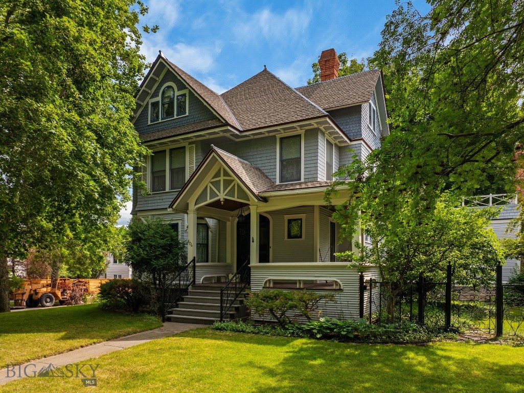 Welcome home to 604 S Willson. This Historic Preservation Award of Excellence winning, well-maintained 1904, 4 bedroom, 3 1/2 bath, 4,556 sq ft home with 2-car carriage house, w/ roughed in 732 sq ft bonus space above has not been on the public market for over 80+ years. This stately, architecturally designed Queen Anne Craftsman is nestled on a corner knoll in Bozeman’s charming, historic S Willson neighborhood, 5 blocks from Bozeman’s downtown, Main St, moments from the MSU campus, the Sourdough/Gallagator Linear Trail system, recreation, & all things Bozeman. Having not exchanged ownership in 50+ years, this turn of the century residence features 3 stories in addition to a basement level, an oasis of a backyard, mature landscaping, English gardens, irrigation well & historic custom designed hand-wrought iron hand rails, gates, & fencing. The property's 2-stall carriage house, boasts workshop space up front, an I-beam installed w/ a chain hoist for heavy lifting, 220v electrical, storage for outdoor gear, side off-street parking, & alley access in the back. The carriage house's 732 sq ft upstairs bonus area is prime for additional guest quarters, home office or artist’s studio. Every inch of this property offers character & a sense of Bozeman’s history; from the welcoming wrap-around covered front porch, original hardwood finishes & floors, leaded glass, & other preserved accents. The homes spacious completely-private backyard is ideal for hosting events, entertaining, or simply relaxing & unwinding & provides a grand arboreal canopy, a large back deck & fabulous 2nd-level sun deck overlooking the private outdoor oasis. With main level kitchen, dining, & dual living areas, the home's layout flows effortlessly from room to room. The 2nd level provides a primary bedroom, 2 additional guest bedrooms, bath, large laundry area & sun deck access. The 3rd floor has a cathedral ceiling & offers addt'l space for guest bedrooms, has an ensuite bath & versatility whether utilized as cozy guest quarters, a home office, or creative space to suit other needs. The basement level has separate exterior access & an additional 1090 sq ft of storage, hobby space &/or is simply awaiting the vision of its next owner. This captivating home is locationally perfect to fully embrace Bozeman’s downtown lifestyle, shopping, dining, entertainment, & outdoor recreation. Don’t miss this once-in-a lifetime-opportunity to own this ideally located, downtown, University-centered property.