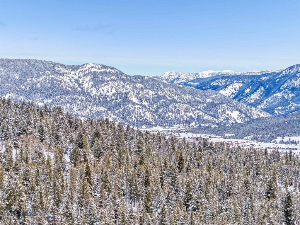 This two-acre homesite, located in the Ranches Neighborhood of Spanish Peaks Mountain Club, is ideally situated just minutes from the Clubhouse, Montage Big Sky, and Big Sky's Town Center. The property offers a tranquil sense of privacy, thanks to an acre of open space at the back and additional surrounding open areas, complemented by old-growth trees. Enjoy eastern views of the Gallatin Mountain Range, creating a picturesque setting for your future residence.

Through the Social Membership with Spanish Peaks Mountain Club, you will have access to a variety of member amenities, including dining, a bar, a workout facility, and men's and women's locker rooms with private access to the pool and hot tub. The membership also provides preferred access and discounts to Montage Big Sky and the soon-to-open member lodge, Aspire. Aspire will feature elevated dining experiences, a bar, a pizza kitchen, comprehensive fitness programs, and family-friendly recreational options, seamlessly blending luxury and lifestyle.

Additionally, the Social Membership grants limited access to the Tom Weiskopf-designed 18-hole Championship Golf Course, as well as the new 10-hole Tom’s Par 3 Golf Course. Both courses are complemented by the adjacent Clubhouse, which includes a pro shop and all the amenities you'd expect from a world-class golf facility.

This is an exceptional opportunity to experience the ease of luxury living at Spanish Peaks Mountain Club. Don’t miss the chance to see this remarkable homesite in person!