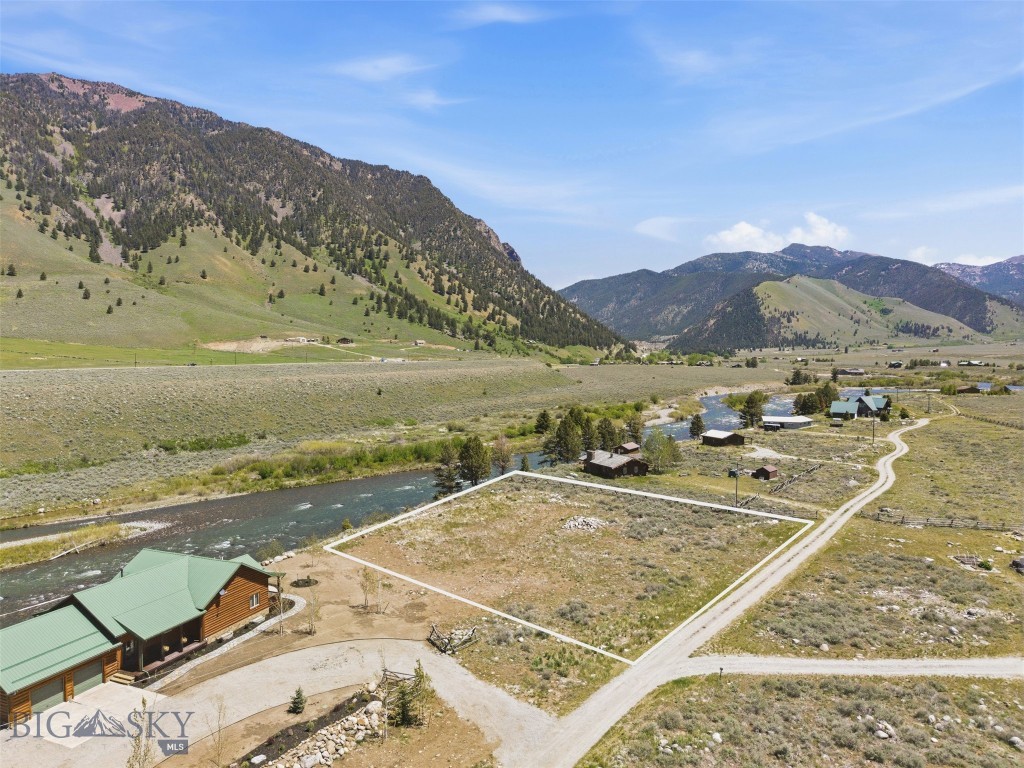 Rare Madison Riverfront Lot! Build ready and waiting for you! Opportunities like this don’t come often, a build ready lot on the legendary Madison River, offering privacy, quiet, and unmatched recreational access. Located in a small, private neighborhood with well-maintained roads and year-round access, this property is ready for your dream home or investment project. The well and septic are approved, with power and fiber optics already to the lot. Unlike many stretches of the Madison, this is a wade-only section, meaning no boats floating by, just the peaceful sounds of the river and the beauty of nature all around you. Short-term rentals are allowed, giving you flexibility whether you plan to enjoy the property yourself or generate income. Wildlife is abundant, and endless outdoor activities are nearby, from hiking trails and alpine lakes to world-class hunting and fishing.  There’s no active HOA with mandatory dues; property owners simply contribute as needed for road maintenance.