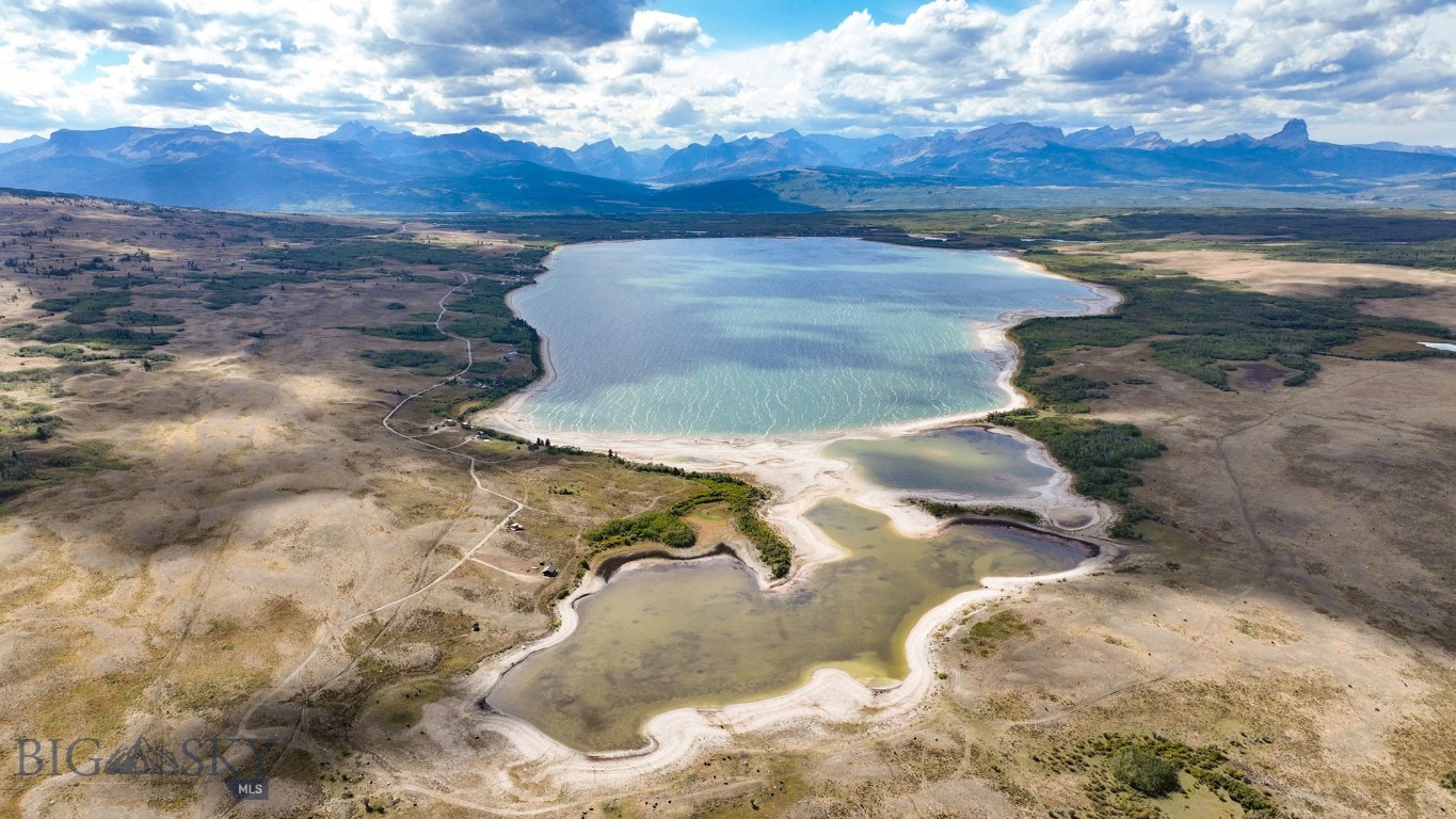 A generously sized, 1.21 lakefront acre lot ON the most easterly part of the lake with phenomenal fishing, per seller! If you have never visited Duck Lake, this is your chance. Buying here is like owning a piece of Glacier National Park with all its beauty and romance. Fish the lake, year-round, or enjoy days sitting on the shore with monumental mountain views. The land is mostly flat with easy access to the lake with a nice assortment of trees for privacy. Just bring your boat and pole and enjoy the Montana lake lifestyle! The area is surrounded by all kinds of recreational opportunities to include snowmobiling, hunting, fishing, hiking, and boating. Minutes to Canada, too. Expect to see all sorts of wildlife walking through your property. No well; no septic.