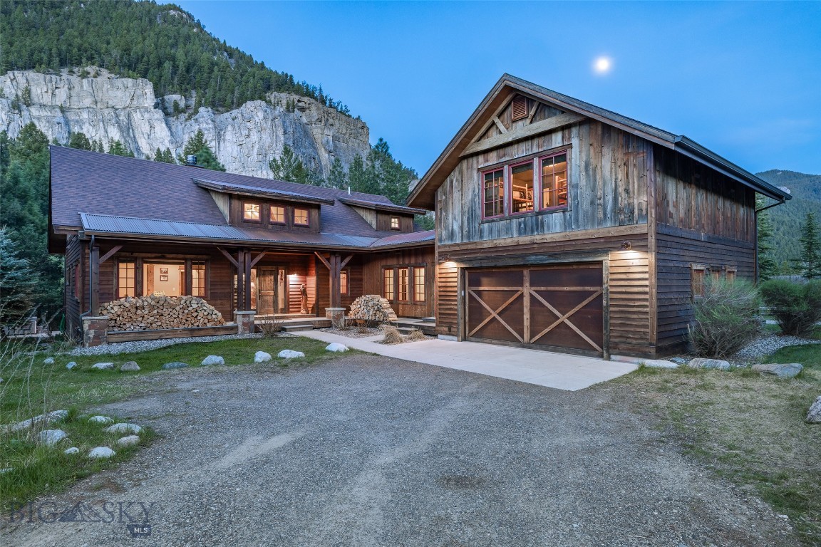 A river runs through it-and defines everything. Crooked Canyon Lodge nestled on one of the most iconic stretches of Gallatin River, where the canyon walls rise beneathStorm Castle peak and the water moves with quiet power through the landscape. This is true riverfront living, with private access to blue ribbon trout water just steps away from your door. Each cast, each morning, each season, is shaped by the rhythm of the river. The 3501 ft.² custom large blends craftsmanship of comfort offering four bedrooms additional sleeping spaces in 3 1/2 bath. The main level master suite opens to a private deck above the river, while gathering spaces are designed for connection-anchored by well appointed kitchen, generous dining area, and expensive views. Separate 1940s cabin and rustic riverside bunkhouse creative Legacy compound feel-ideal for hosting retreating or simply spreading out and enjoying the setting. Set an approximately 4 acres across two parcels with Gallatin national Forest nearby in Yellowstone park with an easy reach this property places you at the intersection of solitude and adventure located on the very waters featured in the movie River runs through it crooked Canyon Lodge offers more than ownership- it offers immersion and water Montana story landscapes.