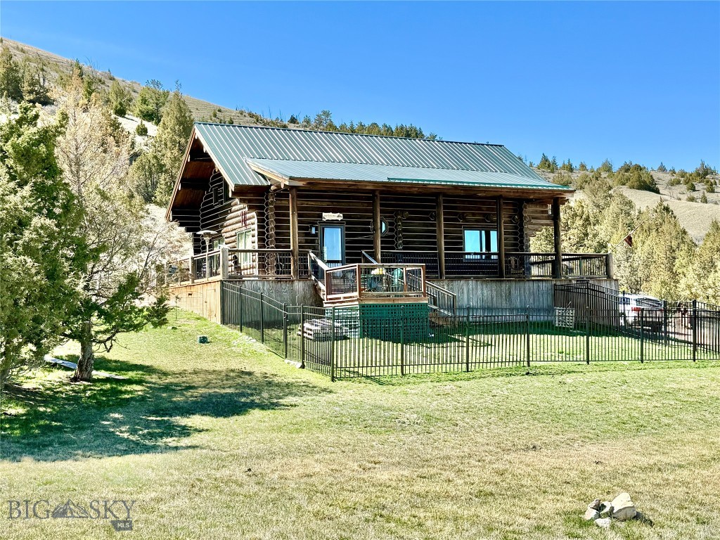 Montana lifestyle - BEAUTIFUL CUSTOM LOG HOME on ~10 acres. Peaceful setting, tucked against a hillside overlooking the property. The north side of the lot has a nice level area, perfect for a shop/barn and pasture. The home features gorgeous log-work with black accents and lots of windows to provide enjoyment of the scenery and bring in natural light. Inside, enjoy the mountain ambiance, cozy wood fireplace and radiant floor heat. Outside, enjoy the covered front porch, wrap-around deck and sitting areas to take in the views and observe the wildlife that meander on the property. The upstairs master suite opens to a covered deck as well. The unfinished basement provides ample storage and may be finished to fit your lifestyle. This is chink-less log home construction; however, the seller added chinking for aesthetic beauty and character. This home sells with indoor and outdoor furniture and useful outdoor tools/items. The home is solar powered with back-up generator and has a 25gpm well and permitted septic. Year-round access on Pole Gulch Road - only 3 miles from the County-maintained road. Pole Gulch road splits the lot and there is useable flat terrain conveniently accessed from the newly constructed Horseshoe Hills Hollow Road. Located in Clarkston, where area attractions include the Missouri, Gallatin and Madison Rivers; Fairweather Fishing Access; and Headwaters State Park. The local towns of Manhattan and Three Forks are ~25 miles with Bozeman and the international airport ~40 miles. This home will qualify for VA and FHA financing.
