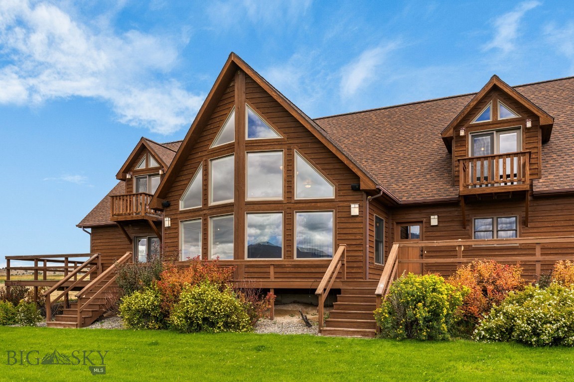This custom-built residence offers over 3,500 square feet of thoughtfully designed living space on just over 5 acres with irrigation water and handlines. The beautifully landscaped grounds feature a manicured lawn with an underground sprinkler system and a wrap-around deck extending along three sides of the home, ideal for enjoying the surrounding views of the Ruby Mountains. Inside, the home includes 4 bedrooms, with one well-suited for use as an office. The primary suite offers a walk-in closet, bathroom with a jetted tub, and private deck access to the hot tub. Two additional upstairs bedrooms are generously sized, each with large closets and private balconies. The formal dining room provides direct access to the deck, creating excellent space for gathering and entertaining. The kitchen is equipped with granite countertops, stainless steel appliances, and abundant
cabinetry. The main living area showcases vaulted ceilings, expansive windows that frame the mountain views, and a gas fireplace. Additional features include central air conditioning, central vacuum, and a landscaped yard with underground sprinklers. This property combines comfort, functionality, and scenic beauty with ample space both indoors and outdoors.