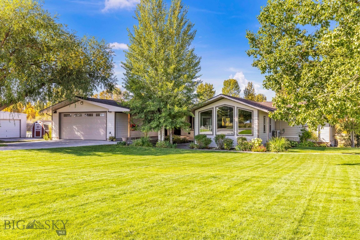 Country Living with Mountain Views – Fully Remodeled Home on 2.5± acres with brand-new ADU and shops.
Enjoy the best of both worlds with peaceful country living just minutes from Manhattan and the Gallatin River. This beautifully remodeled home (2021) sits on 2.5± acres with stunning Bridger Mountain views and every upgrade you can imagine. The main home features a vaulted tongue-and-groove ceiling in the living room, a bright and modern kitchen with updated appliances, walk-in pantry, and eat-in bar. The spacious main-level primary suite includes two large walk-in closets and a luxurious tiled shower. A huge guest bedroom with built-ins, a roomy laundry area with second fridge, and a walk-out basement with additional bedrooms, family room, and ample storage make this home as functional as it is beautiful. A brand-new (2025), never-used 1-bedroom ADU offers additional living space or rental income potential, complete with full kitchen, living area, bathroom/laundry, and its own separate entrance. Outdoor living shines with a large covered deck, expansive patio, mature landscaping, and vibrant perennial gardens. The property is handicap accessible and thoughtfully designed for both comfort and utility. Outbuildings include a charming dairy barn/garden shed, greenhouse, chicken coop, open-front hay/equipment shed, a 36' x 72' shop with front and rear lean-tos, and a 30' x 60' heated, insulated shop with a 12' x 50' lean-to—wired for welding and ready for any project. Fully solar-powered with storage capacity to operate independently for 5–7 days without sunlight.