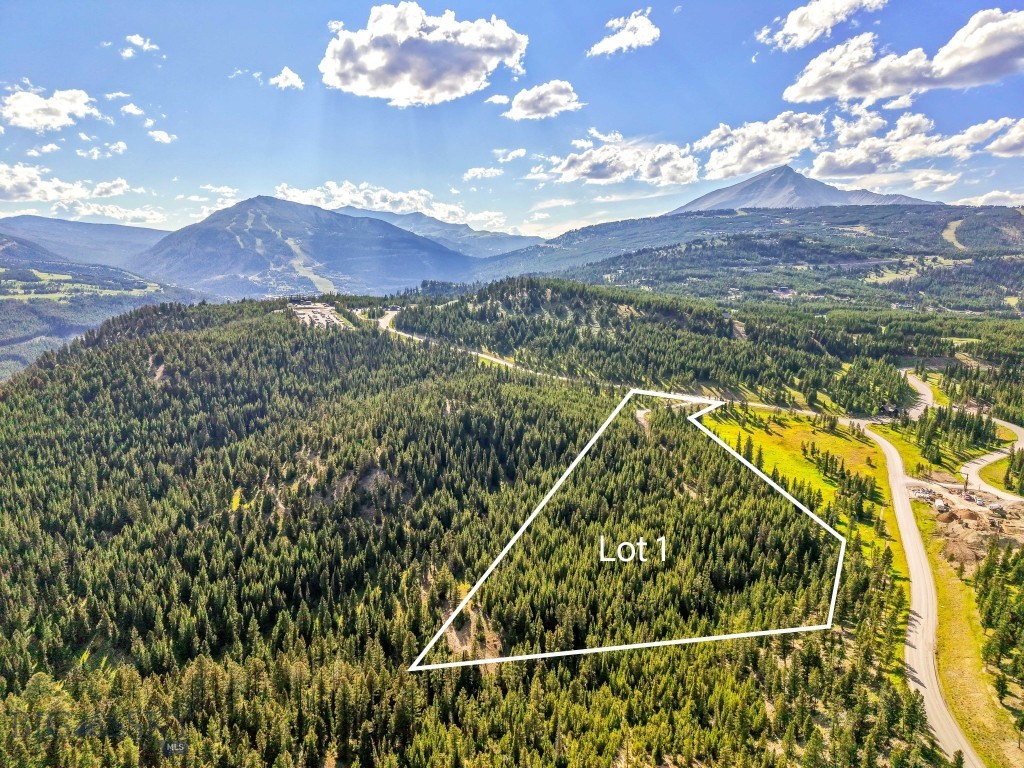Tucked into a private grove of mature forests and expansive open space, Lot 1 in Wheatgrass Meadows spans 9.48 acres of private, pristine mountain living within Spanish Peaks Mountain Club. One of only two homesites in this exclusive new developer release, this property offers a rare opportunity to create a legacy estate in one of Big Sky’s most desirable communities.
This is not just a parcel of land—it’s a canvas with extraordinary potential. Initial landscaping and a rough driveway are already in place, making it easy to explore the site and start envisioning your future home. Picnic tables with scenic views have been thoughtfully placed to encourage you to pause, breathe in the fresh mountain air, and soak in the panoramic landscape.
Very few properties offer this kind of scale and flexibility—design an 8-bedroom main residence alongside a 3-bedroom guest home, all set against the stunning backdrop of Big Sky’s rugged beauty. Whether you’re bringing your own team or prefer a streamlined approach, you have the option to leverage the Spanish Peaks Design Build Program, which simplifies the entire building process.
A Signature Golf or Social Membership is available with this property, providing access to the premier amenities of Spanish Peaks Mountain Club, including Tom’s 10 Par 3 Golf Course, the new Aspire Lodge, and a network of trails and recreational offerings. Just minutes away, the Montage Big Sky delivers five-star hospitality, fine dining, a world-class spa, and ski-in/ski-out access to Big Sky Resort.
Lot 1, Wheatgrass Meadows is where the unmatched beauty of Montana meets the elevated lifestyle of Spanish Peaks. This is a legacy property—ready for your vision.