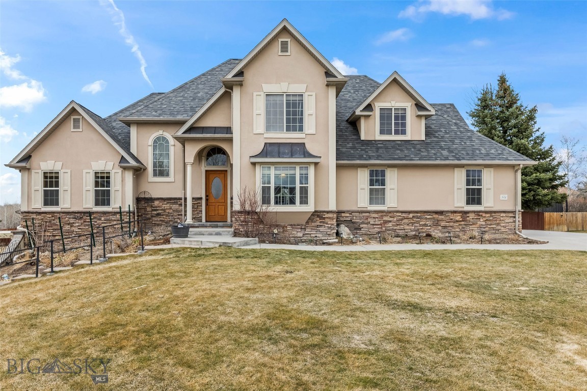 Beautifully positioned at the end of a quiet cul-de-sac, this European-inspired former Parade Home sits atop a spacious 1/3-acre lot, offering expansive views and exceptional privacy. Designed with quality and craftsmanship in mind, the home features custom concrete and hardwood floors throughout, paired with an efficient 6-zone in-floor radiant heating system for year-round comfort. Thoughtful custom finishes include solid wood interior doors, detailed trim work throughout, and a cozy gas fireplace that anchors the living space. The remodeled kitchen is complemented by newer stainless steel appliances, making it both stylish and functional for everyday living and entertaining. Step outside to enjoy the large deck, perfectly positioned to take in the surrounding views. A high-end integrated audio system extends through much of the home and outdoor areas, creating an ideal setting for entertaining. The basement has been recently updated to include private guest quarters or potential ADU, complete with a full kitchen and separate entrance, making it perfect for guests, multigenerational living, or potential rental opportunities. Additional highlights include a new hydronic heating system with combination boiler (installed in 2017) delivering endless hot water and 95% efficiency, Corebond insulation for superior energy performance, newer roof and exterior paint, and a heated 2+ car garage. Every detail has been thoughtfully considered in this quality custom home for the discerning buyer seeking comfort, craftsmanship, and timeless style.