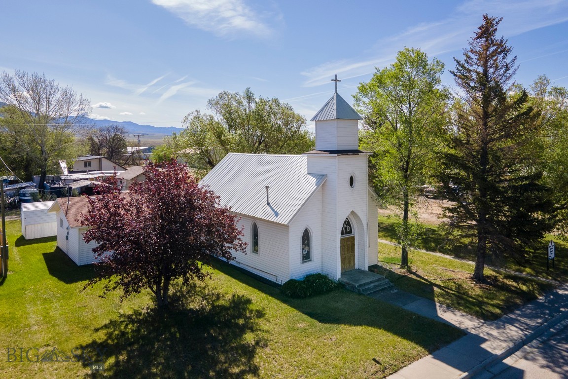 With a meaningful history in the Twin Bridges community, the former Notre Dame Missionary Church offers a versatile opportunity for its next chapter. Built in 1950 and thoughtfully maintained over the years, this 2,176± square foot property is well-positioned for a range of future uses. Inside, the vaulted sanctuary offers an open, light-filled space, complemented by a large community room suited for gatherings and events. The layout also includes a full kitchen with an adjoining smaller gathering space, two bathrooms, handicap-accessibility, and a dedicated mechanical room providing practical storage. The overall design balances functionality and character, offering flexibility for a variety of needs. Situated on a prominent 0.643± acre corner lot along Main Street, the property is framed by mature trees and includes a dedicated off-street parking area. Its prime, high-visibility location within Twin Bridges enhances both accessibility and potential. Whether continuing as a place of assembly or being reimagined for a new purpose, this property presents a compelling opportunity for those who recognize both its established presence and the possibilities ahead. For more information or to schedule a private showing, please contact your real estate professional.