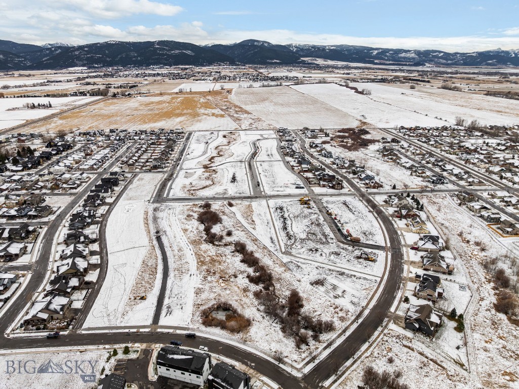 Welcome to Meadow Bridge, Bozeman’s newest premier neighborhood on the desirable south side. This thoughtfully planned subdivision features 45 fully entitled homesites, ranging from approximately 4,000 to 14,000 square feet—perfect for bringing your custom dream home to life. Enjoy breathtaking views of the Bridger Mountains, enhanced privacy, and direct access to open space and nearby parks. Ideally located just minutes from historic Downtown Bozeman, Meadow Bridge offers convenient access to dining, shopping, recreation, top-rated schools, and Montana State University. This is a rare opportunity to build in a quiet, close-knit community while still enjoying all the amenities Bozeman has to offer. This particular lot is one of the larger homesites in the subdivision and is adjacent to open space, providing additional privacy and a more expansive setting. With generous lot sizes and flexible design options, you have the freedom to create a home that fits your lifestyle—whether you envision a modern farmhouse, a charming cottage, or a thoughtfully designed two-story home. Bring your builder and turn your vision into reality at Meadow Bridge.