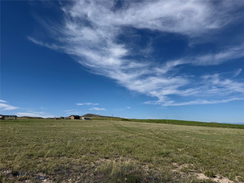 This is your opportunity to own 5.04+/- acres with sweeping mountain views, where wide-open skies and abundant wildlife create a true western retreat. Perfectly positioned just 15 minutes from town, this property delivers the ideal balance of privacy and convenience. Enjoy quick access to dining, shopping, and services—then return home to peace, quiet, and unforgettable sunsets. Outdoor enthusiasts will love the excellent fishing, hunting and skiing nearby, making this an ideal location for your future dream home or getaway retreat. A well is already in place, saving significant time and upfront expense and adding immediate value for buyers ready to build. Up to five large animals are allowed, perfect for horses or 4-H animals. With usable acreage, breathtaking scenery, and infrastructure already started, this property is a rare offering in today’s market—perfect for a full-time residence or weekend getaway.