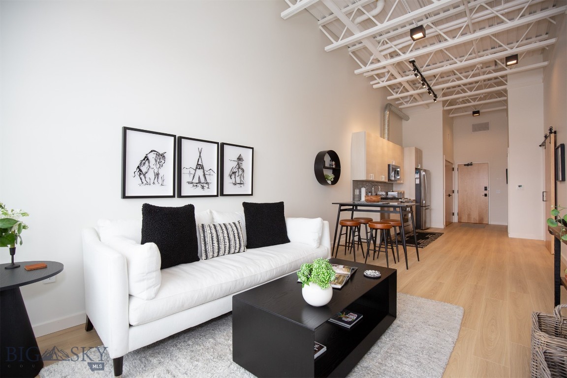 Step right into this beautifully upgraded, turnkey condo in the vibrant Aspen Crossing building—one of Midtown Bozeman’s hottest spots! Bathed in natural light year-round, this south-facing 2-bedroom, 1-bath unit features expansive windows and elevated finishes throughout.

The second bedroom offers versatility—perfect for a stylish home office or cozy guest room. Floors have been recently updated to wide-plank oak laminate that’s as durable and easy to maintain as it is eye-catching.

Whether you're looking for a full-time home or a part-time Bozeman base, you'll love the energy of Aspen Crossing. With popular local hangouts like Ponderosa Social Club and Bourbon BBQ just steps away, there's always something happening right outside your door.

Though this condo has never been rented, similar units in the building enjoy strong demand and excellent occupancy for both mid- and long-term stays—making it a potential investment opportunity as well.

The unit is offered fully furnished (with just a few exclusions—ask Liz for details), so you can start enjoying the Midtown lifestyle from day one.

Interested? Reach out for more details or contact your agent today to schedule a private showing!