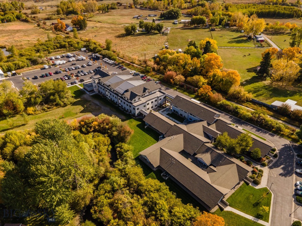 Amazing office property in quiet northeast Bozeman location. Tucked away in the trees, but close to the Cannery District, Downtown, Interstate 90 with walking trails right at the edge of the lot. Amazing views of open space and the Bridger Mountains, with Bozeman Creek running along the West border of the lot. Adjacent access to Story Mill Community Park and the Trail to the M. Great finishes throughout this office complex with individual climate control in each office. There is a nice reception area, several conference rooms and mail/copy rooms. Building A is the western building, and could be further demised into smaller configurations, feel free to inquire about any size. Entire complex of both buildings also for lease at MLS# 398068.