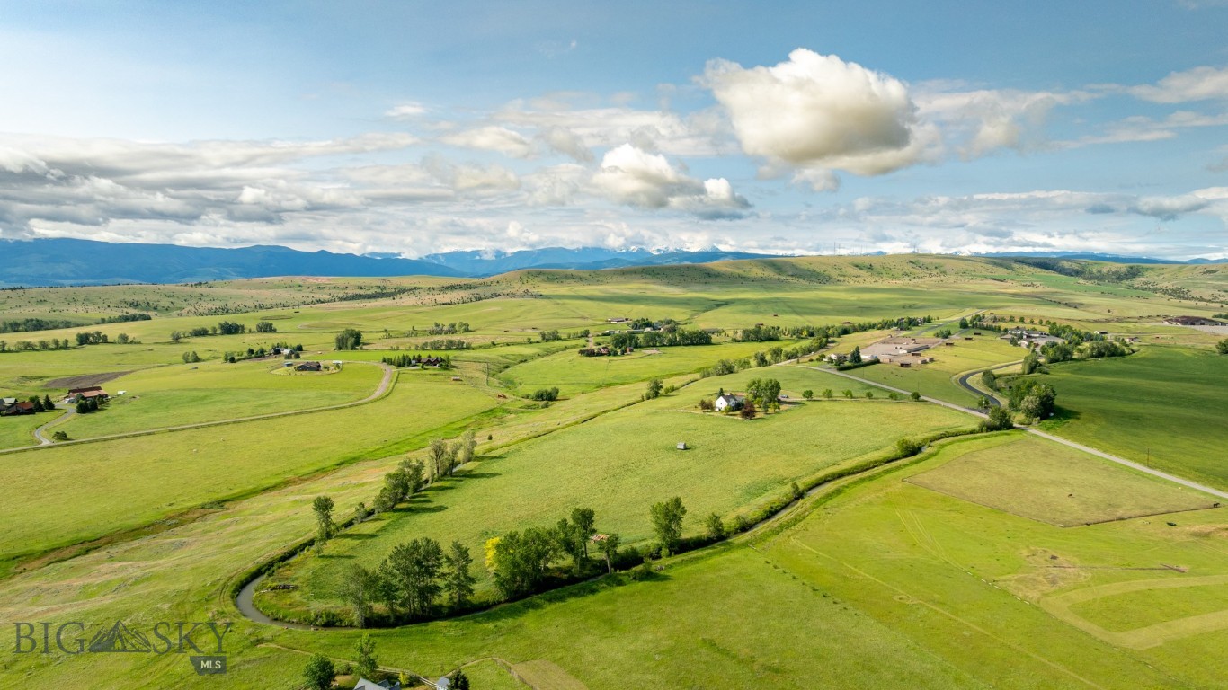 Welcome to 500 S. Pine Butte Road, over 26 acres of pure beauty and usable pasture perched atop a private butte with commanding 360 degree views of the Bridger Mountains, Tobacco Roots, Gallatin Range, and Spanish Peaks. The entrance sits directly across from the gates of the famed Stock Ranch, one of the most scenic and recognizable approaches in the valley, setting the tone before you have even reached the driveway.

Known as the "King Lot" of Pine Butte Trails, this parcel is bordered by the Highline Canal, creating a natural, private boundary that sets it apart as its own secluded island. Total privacy without sacrificing convenience, and as good as it gets for the equestrian buyer. Rolling, open pasture ready for horses, livestock, and more, complete with a large barn already in place to support the working ranch lifestyle.

The 1991 built, 4,680 square foot residence offers 5 bedrooms and 3.5 baths across a generous, functional layout, with a large basement adding flexible space. Good bones, an unbeatable setting, and room to make it your own.

20 minutes from downtown Bozeman. 20 minutes from Bozeman Yellowstone International Airport (BZN). 40 minutes from Big Sky.