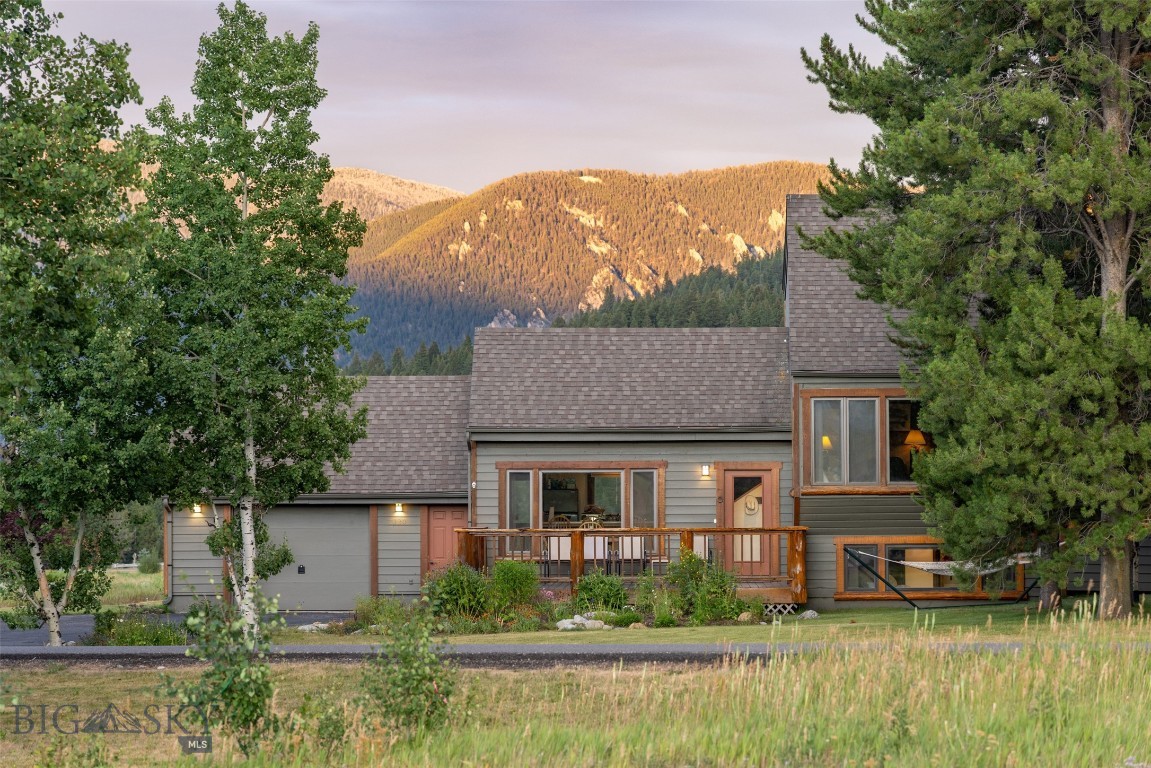 Perfectly positioned in Big Sky’s Meadow Village, 2120 Yellowtail is a charming and well-maintained 3-bedroom, 3-bathroom single-family home offers unbeatable views, direct golf course access, and a lifestyle tailor-made for mountain living. Backing onto the 12th green of the Arnold Palmer–designed Big Sky Resort Golf Course, the 2,136 sq ft home sits on a spacious 0.275-acre lot surrounded by mature trees, natural beauty, and big Montana skies.

From the living and dining rooms, perfectly framed windows put Lone Peak front and center, while the back deck delivers expansive vistas of the Gallatin Range and Levinsky Ridge—ideal for morning coffee or post-adventure sunsets. Whether you’re skiing Big Sky Resort, biking world-class trails, fly fishing the Gallatin, or cross-country skiing just steps from your door, this location puts you at the heart of it all. Shops, restaurants, the post office, and Town Center events are just minutes away.

Inside, you’ll find vaulted ceilings, a cozy wood-burning fireplace, and warm finishes that create a welcoming retreat. The layout is functional and inviting, with three spacious decks and quirky-rustic wood paneling. The attached garage is ideal for stashing skis, bikes, and all the gear you need to live your best Big Sky life. Clean, cozy, and move-in ready, this home offers the perfect balance of comfort, character, and convenience.

Don’t miss your chance to own this slice of Montana paradise. Take a 3D tour today, or better yet, schedule a showing with your favorite Big Sky real estate professional. Priced to sell—this one won’t last long!
