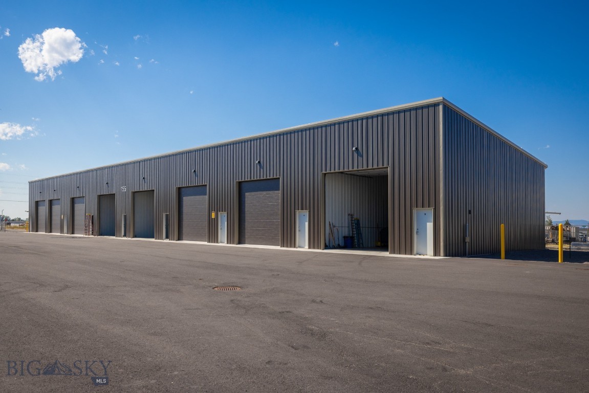 Commercial condo, new construction. Located on the highly sought after Jackrabbit corridor between Belgrade & Four Corners on the way to Big
Sky. Easy in and out access off of Jackrabbit lane. Five minutes to the Bozeman Airport. 14' x 14' overhead garage doors with electric openers,
6" concrete slab, option for mezzanines in back third of units, ceiling height is 19'-11" in front & 16'-3" in the back, Energy Saver Systems
insulated walls R-25 and R-40 ceiling fiberglass insulation, Steel siding on side interior demising walls, This unit does not have a bathroom and is
not permitted for a bathroom, concrete floor French drain in front third of bays, 48" x 48" sliding window up high, 3' x 7' walk through door with
dead bolt, ceiling hung gas unit heater, fully paved lot & entrance off of Jackrabbit lane. Gated entrance with 6' chain link fence with barbed wire
top around perimeter. Great heated units for Collector cars/vehicles, RV/ Boat storage, small businesses, hobby/workshop, furniture, storage.
Due to State law no marijuana businesses are allowed, covenants do not allow engine shops, mechanic shops, all businesses need approval
from Condo Association, no outside parking of equipment or trailers. Additional covered 40' x 12' x 14' storage units available to rent in another
building for trailers or vehicles. Association fees are $913/ year with a one time "in Reserves" setup fee of $350, covers snow plowing, weed
control, insurance, grounds keeping. Seller is a licensed Realtor in the State of Montana. All listing information provided is deemed reliable,
however Buyer/Buyer's agent should verify by performing their own due diligence.