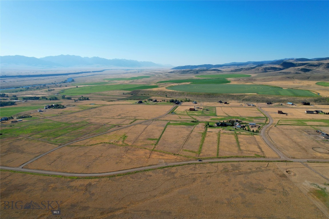 A TRUE piece of Montana.  Nearly 19 acres comprised of 3 contiguous lots.  Perfect horse and ranchette property.  Full perimeter fencing and seasonal irrigation across the entire offering.  Discover the possibilities with this prime location in Shining Mountains II, situated to the east. This sweet package checks all the boxes for those seeking dramatic 360-degree views with the Madison Range, productive irrigated pastureland and easy access to your new generational property in SW Montana. All lots are well-sized and level, offering multiple build sites to take in the ever-changing landscape. Power available in the area. Located 20 minutes from Ennis conveniences and the world-renowned Madison River, a blue-ribbon trout fishery, is just minutes away at the Varney Bridge Fishing Access. Owners have private access to Haypress Lakes, full of trout. Endless recreational opportunities and public lands out the back door, with Bozeman, Big Sky Resort, and Yellowstone NP each an hour drive +/-. Photos include area views. Create your Montana legacy today.