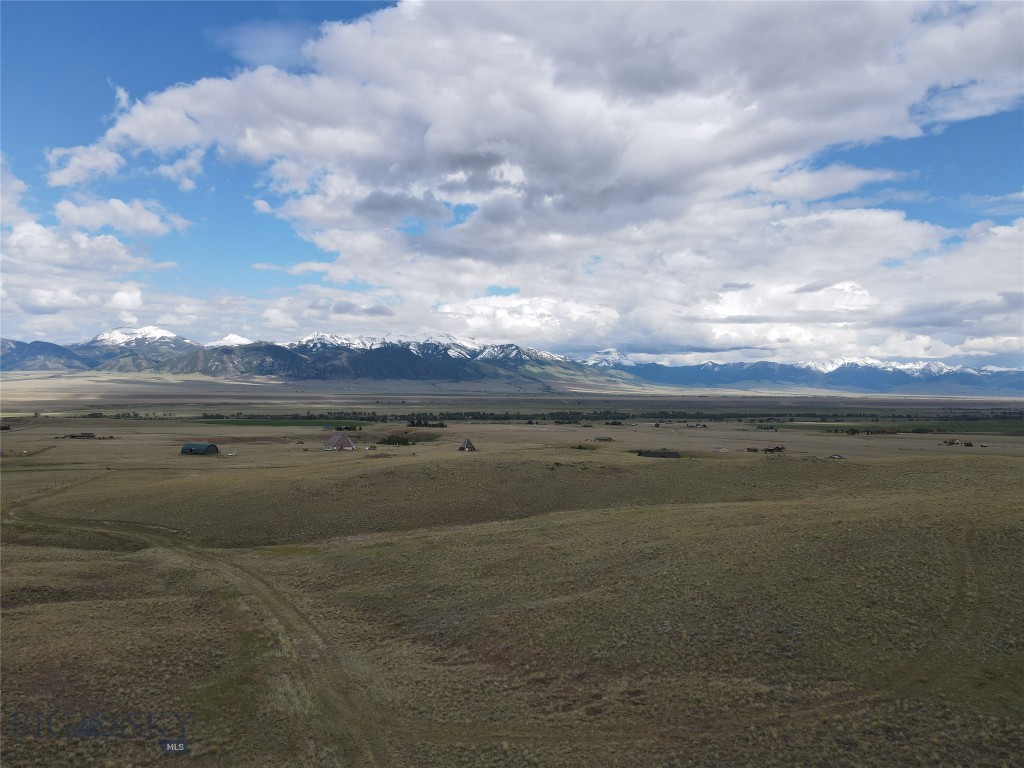 Discover 24 acres of Montana landscape in Trail Creek Ranches, just 15 minutes from Ennis. Featuring dramatic topography and commanding views of the surrounding mountain ranges, Lot 10A offers a unique setting for those seeking privacy, recreation, and wide-open spaces. The varied terrain creates character and natural beauty while providing numerous vantage points to take in the stunning Madison Valley. Outdoor enthusiasts will appreciate the property