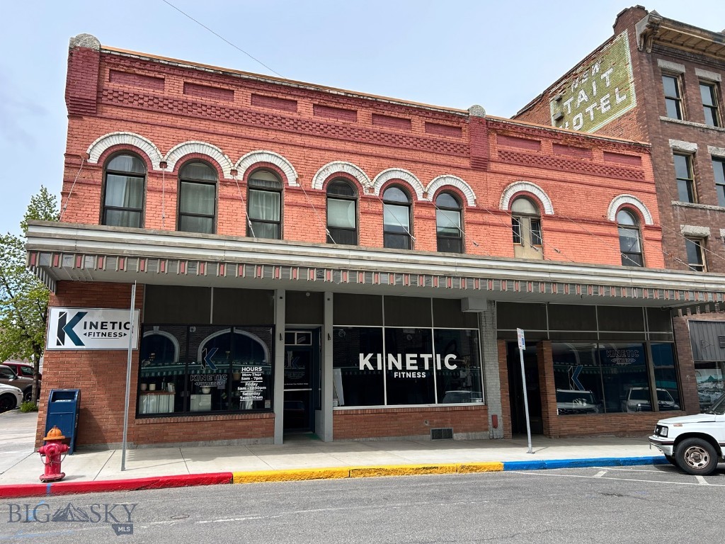 A rare opportunity to buy a mixed-use commercial historic building situated in the heart of Uptown Butte with two commercial spaces, five charming apartments, and a parking lot. Built circa 1900, this brick structure consists of the first floor, approx 3961 sq ft, the second floor, approx 3930 sq ft, and a basement level all heated by a central steam system. The commercial spaces are currently occupied by Kinetic Fitness and feature two large storefronts adorned with a large canopy & restored neon lights, three offices, one full bath, two half baths, a laundry room, & storage closets. The apartments consist of two studio apts, two 1-bedroom apts, and one 3-bedroom apt, all with hardwood floors & historic character. A new EPDM roof was installed in 2017. The building is in the Urban Revitalization Agency District and may be eligible for grants and loans.