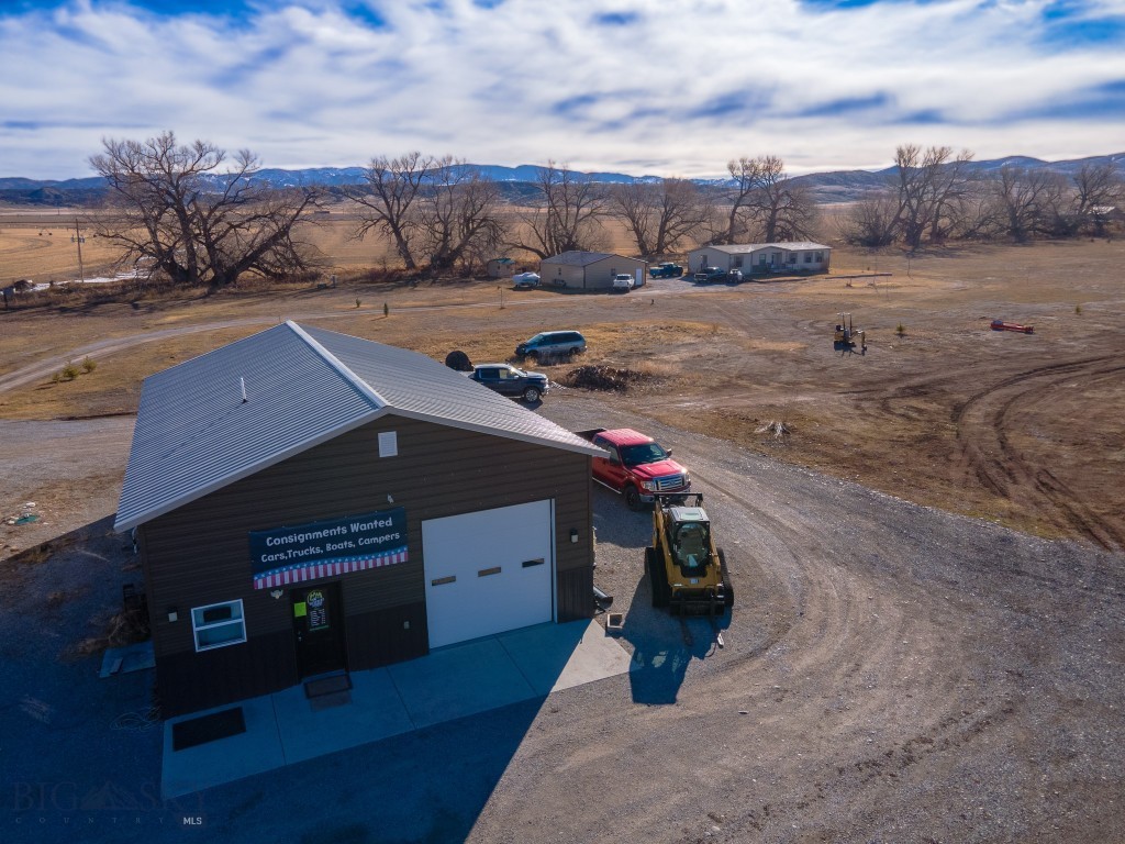 An amazing opportunity to live & work on this 6.65-acre property, with room to subdivide for residential or commercial opportunities. This property includes a single-family home and a 30x50 shop currently being used by the owner for his small business. The home features 3 bedrooms, 2 bathrooms, an open concept kitchen/living area, mudroom & deck overlooking a beautiful meadow. The home also comes with a detached 30x40 garage for plenty of space for your vehicles, toys, & extra storage galore. The shop has 12' walls, (2)10x10 doors w/openers, 132 sf of finished office space, electric baseboard heat, half bath w/washer & dryer hookups, 44-gallon water pressure tank, on demand  hot water heater, suspended gas heater, , fully insulated w/OSB on walls, security cameras, two concrete aprons, floor drain, storage above office & bathroom, separate electrical meter, separate septic & drain field.
