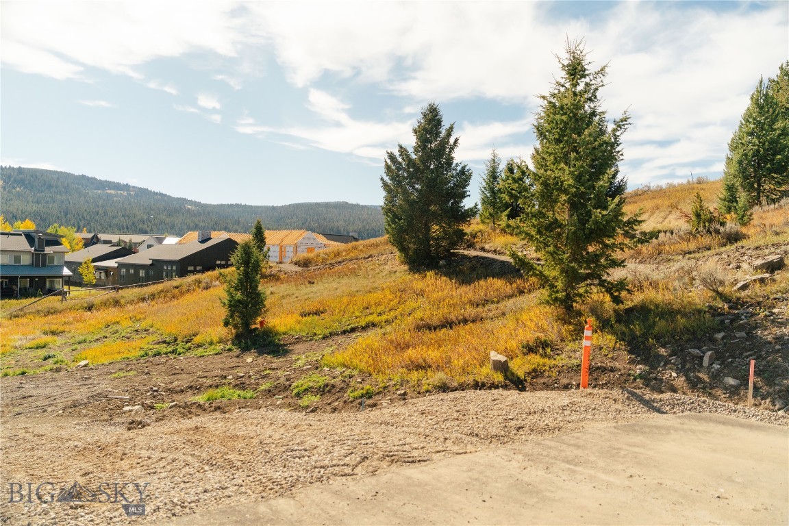 Situated at the end of a quiet cul-de-sac, homesite 26 spans a generous 0.40 acres and offers an ideal setting to build your dream Big Sky home. This homesite enjoys a peaceful neighborhood setting with direct access to the thoughtfully designed trail system, providing an easy connection to the broader local trail network.
Just minutes from Big Sky Town Center, Upper Whitefish offers convenient access to year-round amenities including dining, shopping, community events, and local services. Whether enjoying nearby trails, attending seasonal farmers markets, or taking advantage of Big Sky’s vibrant social scene, residents benefit from the perfect balance of neighborhood privacy and walkable access to everyday conveniences. Lot 26 presents a wonderful opportunity to settle into the heart of Big Sky, Montana.